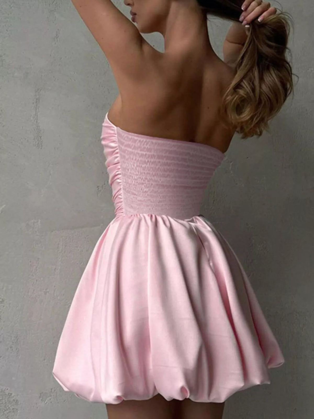 Ruched bubble dress angled view showing hem shape