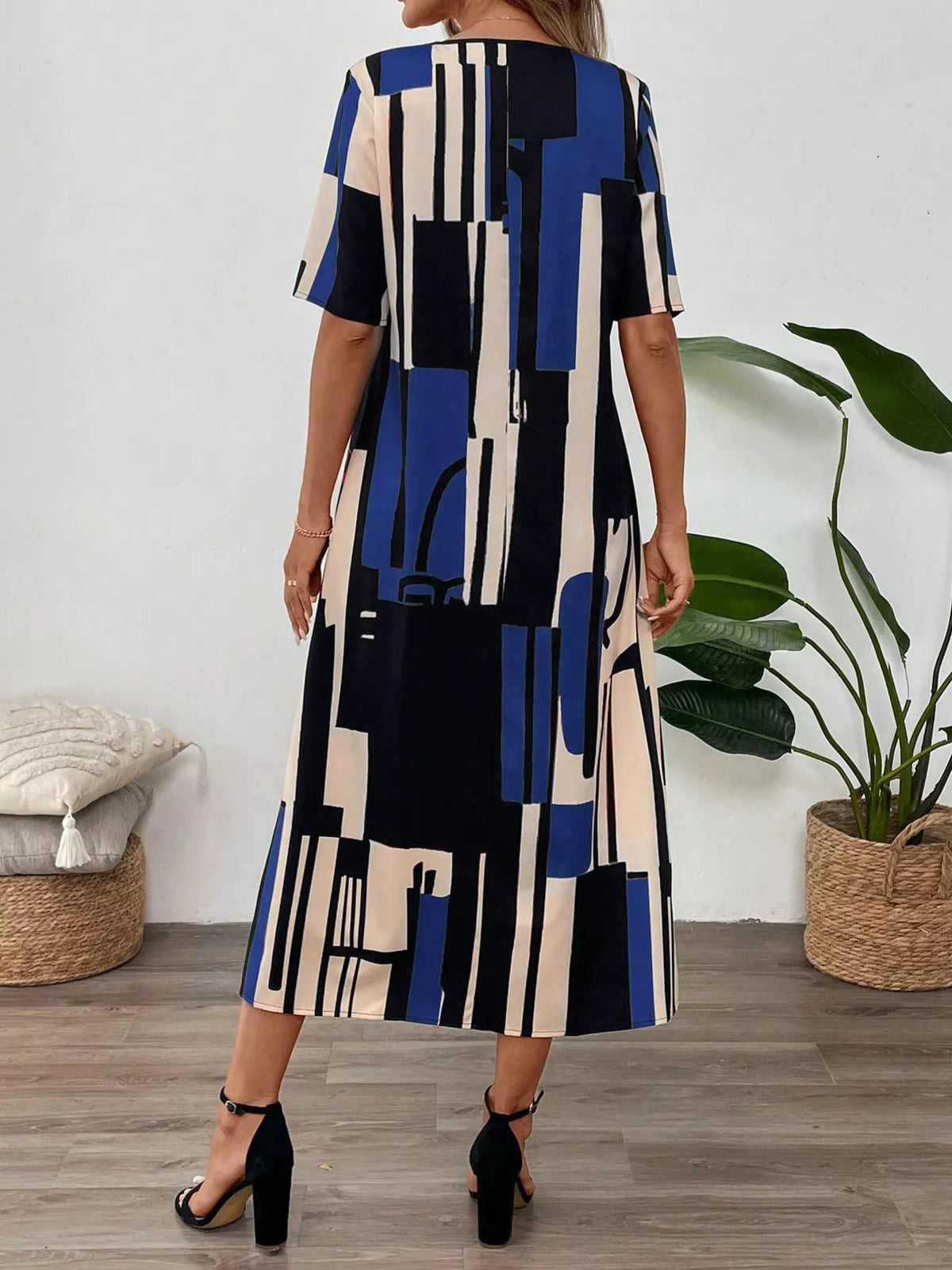 Abstract geometric print v neck midi dress front view