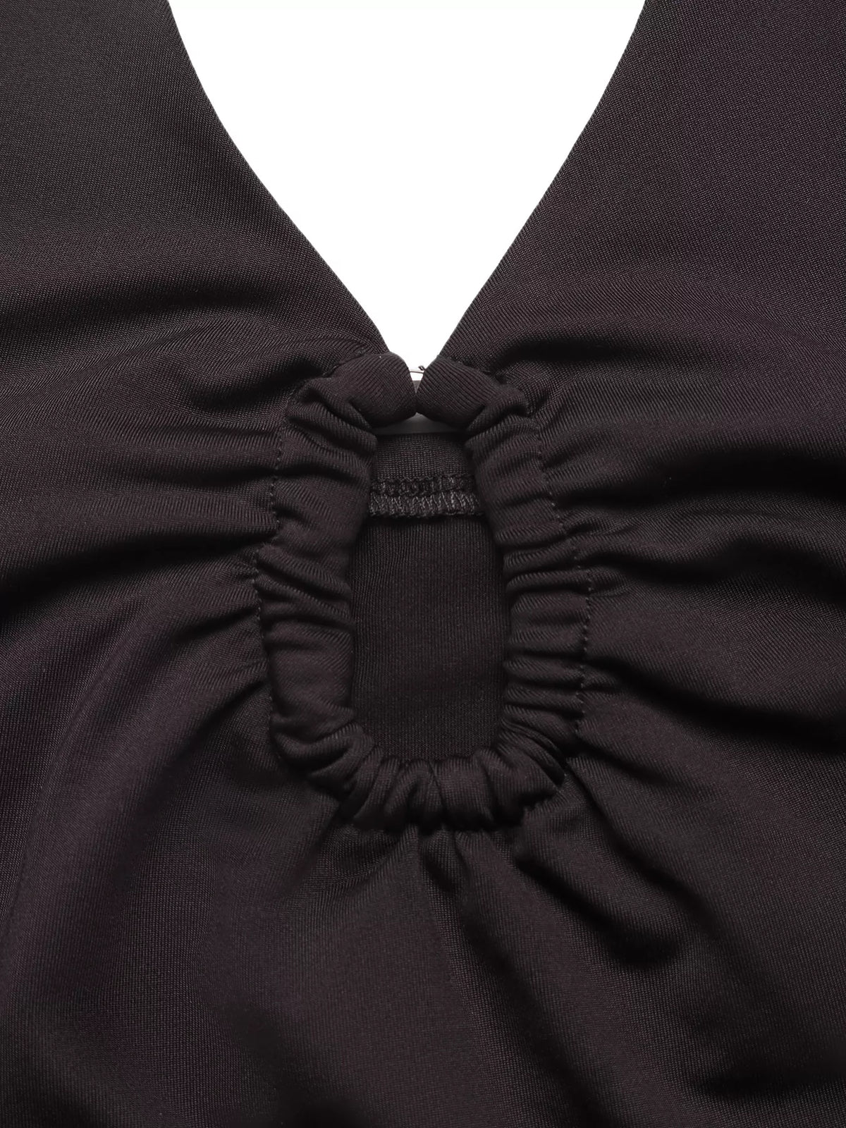 Side view of the fitted black bodysuit