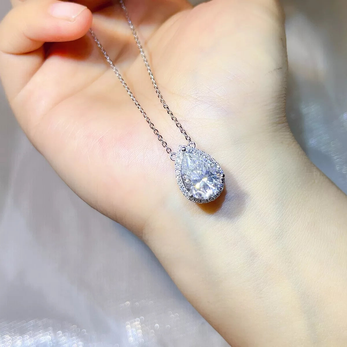 Close detail of the 5ct moissanite stone and silver setting