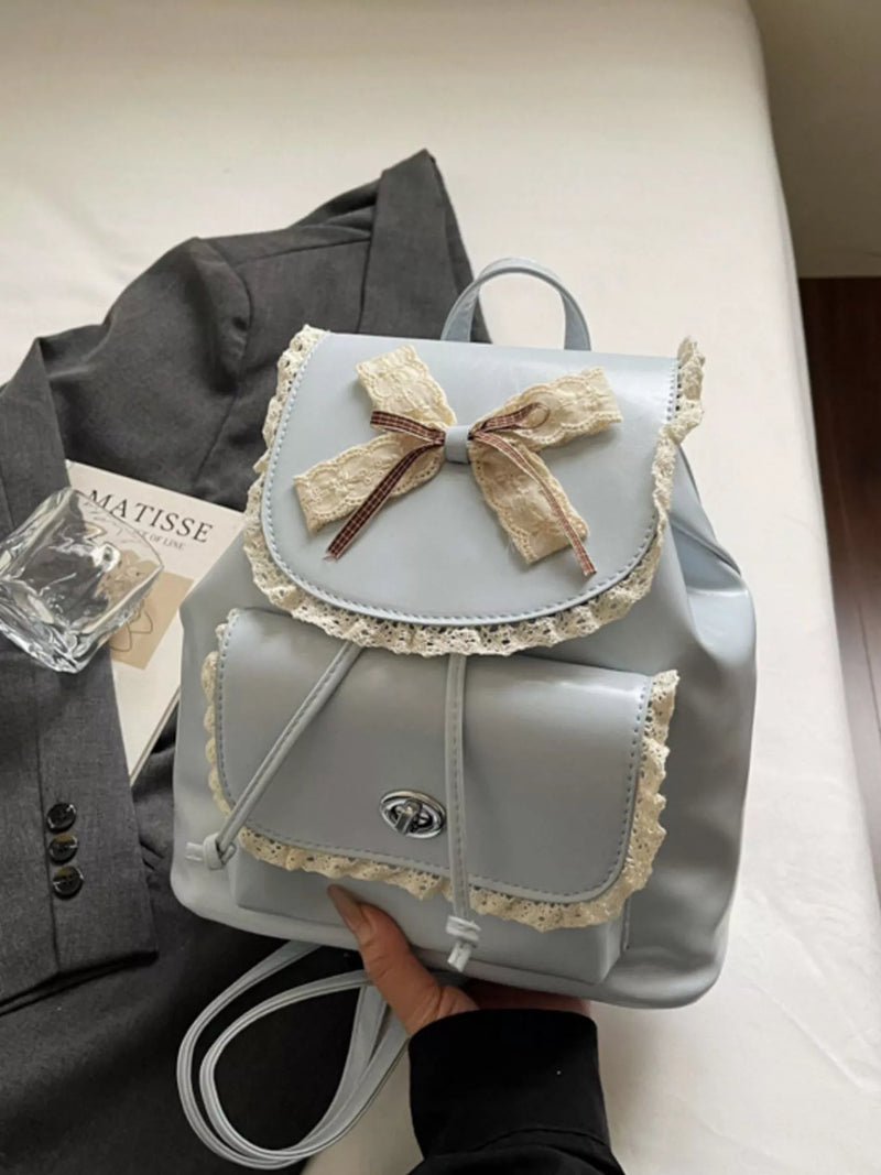 Blue lace bow mini backpack front view
