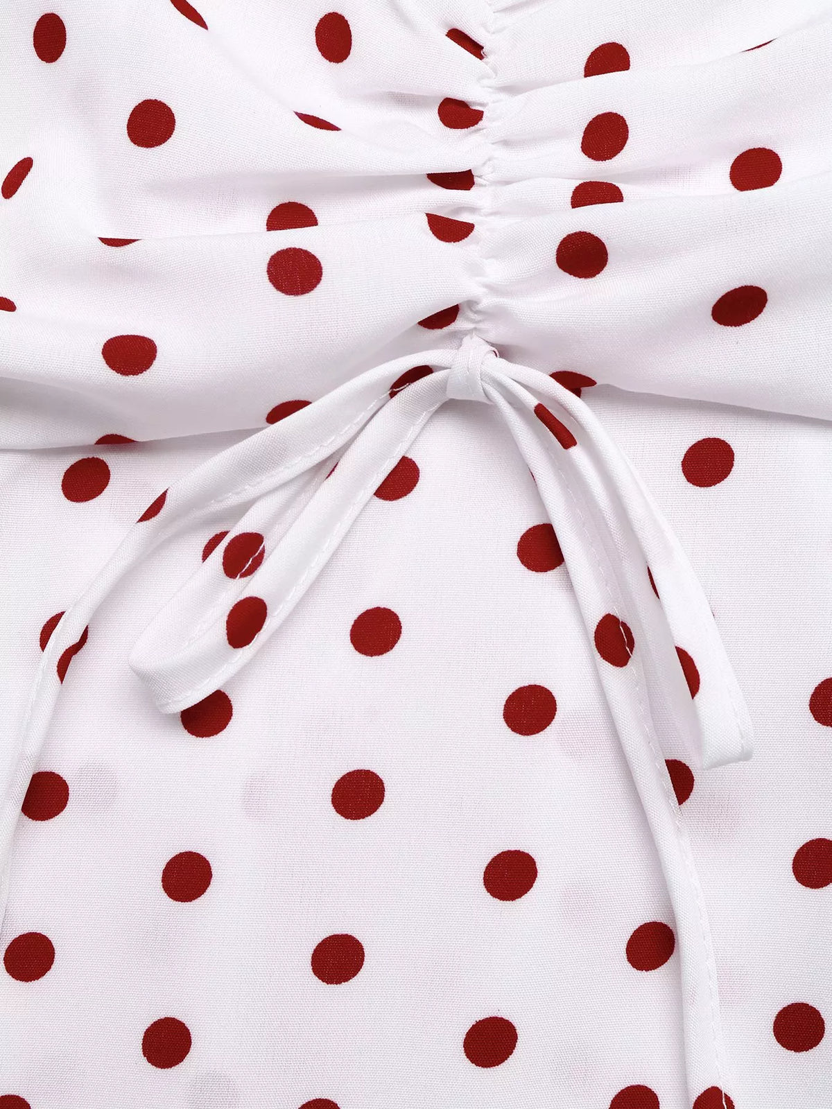 White polka dot ruched cami top close up view