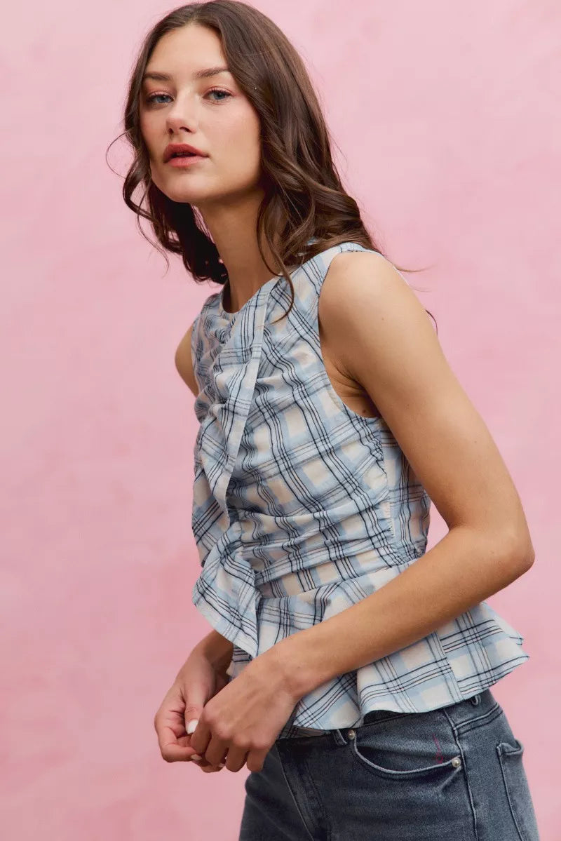 Blue plaid sleeveless ruffle peplum top front view