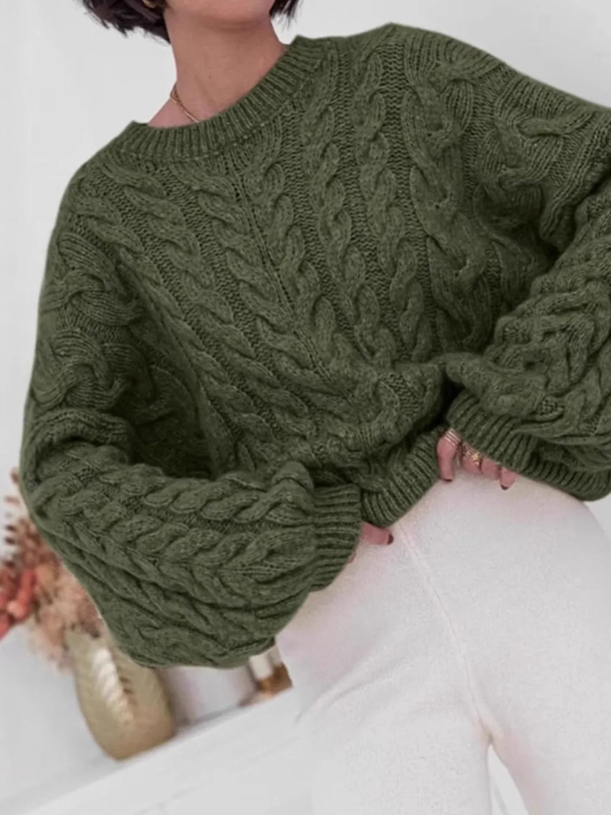 cable knit long sleeve sweater close up texture