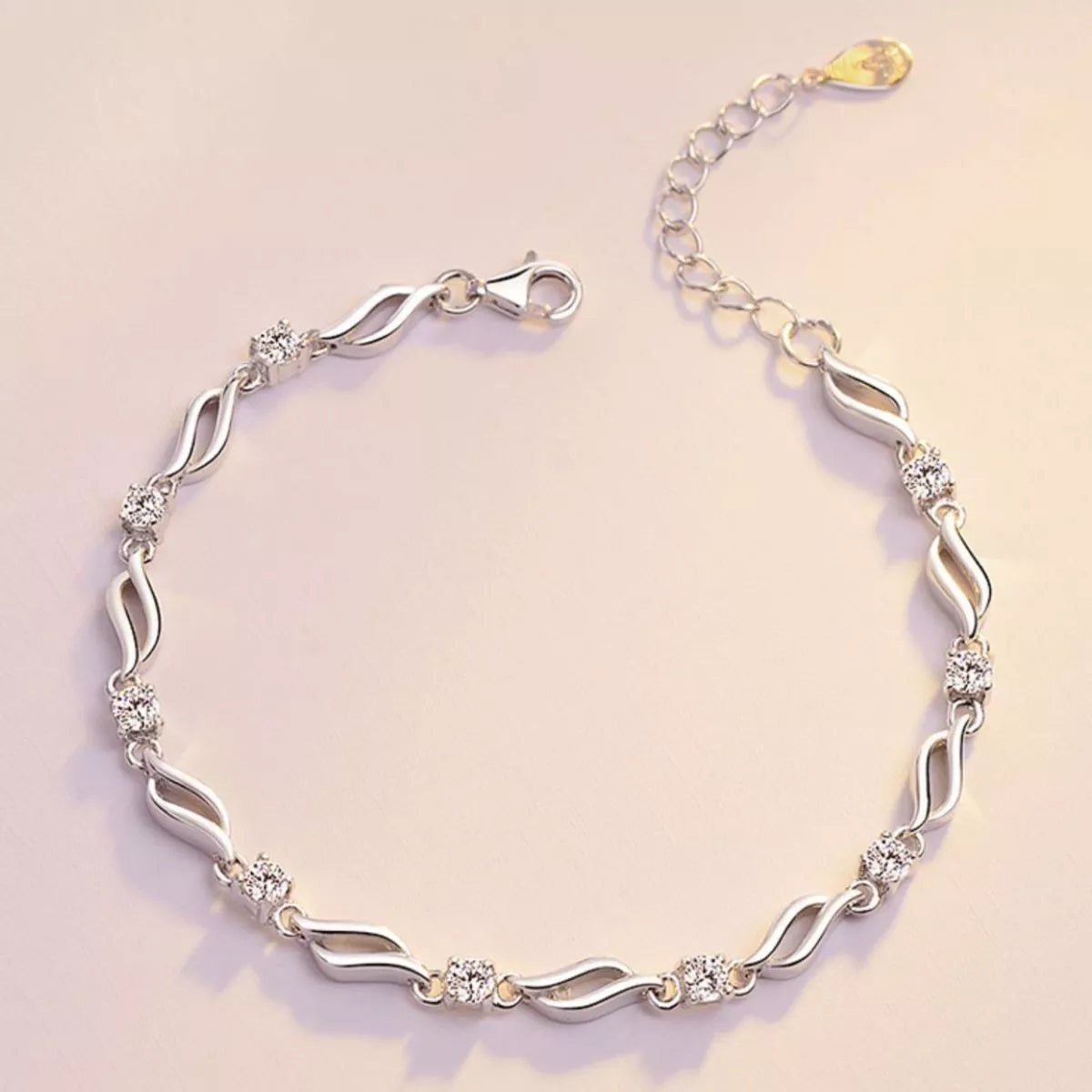 Close up of the zircon stones on the silver chain bracelet