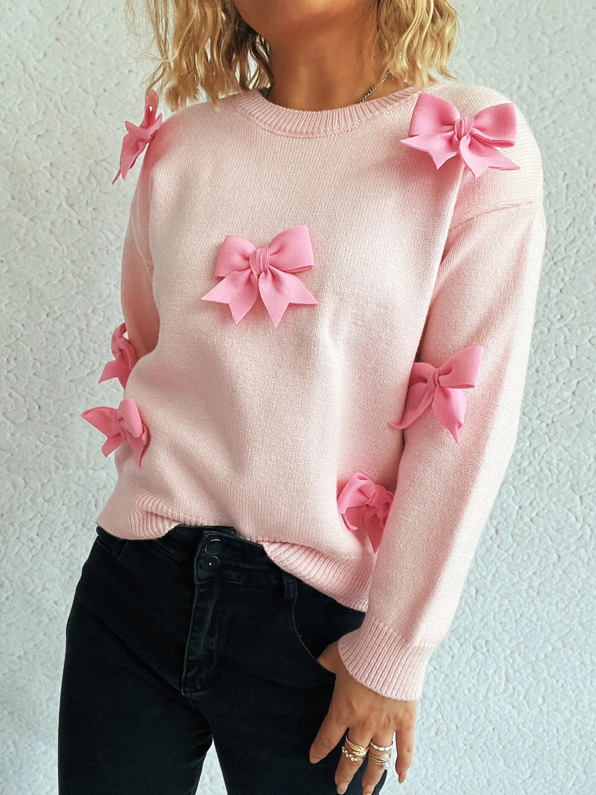 Bow round neck long sleeve sweater close up detail