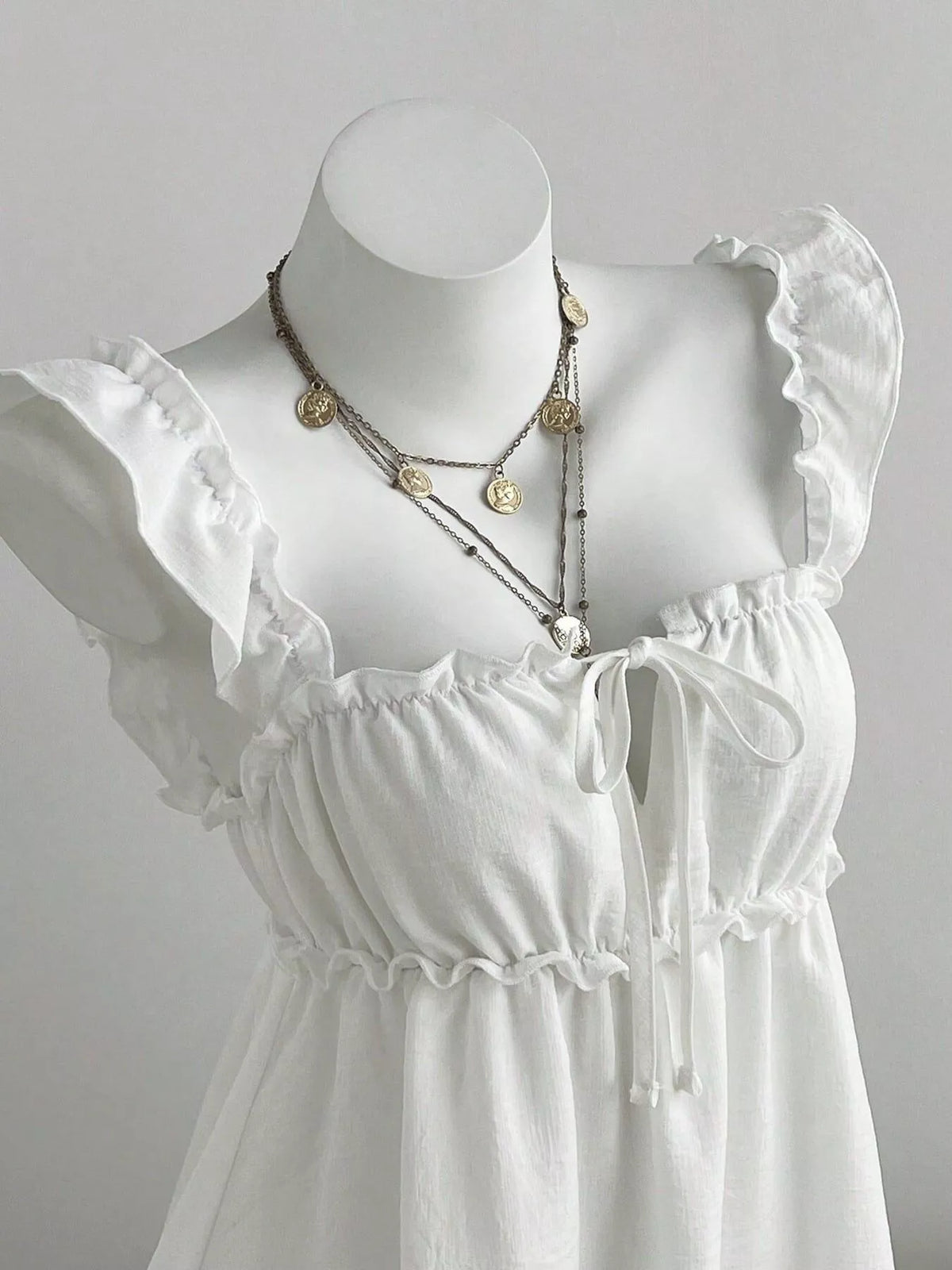 Mini dress shown with the front tie fastened