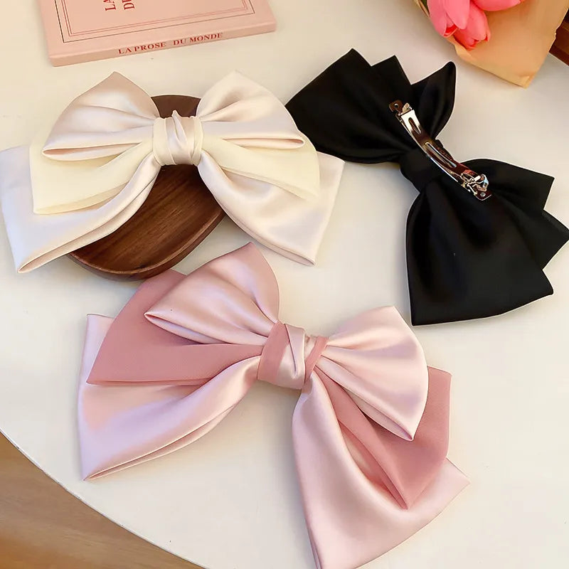 Bow cloth hair clip front view