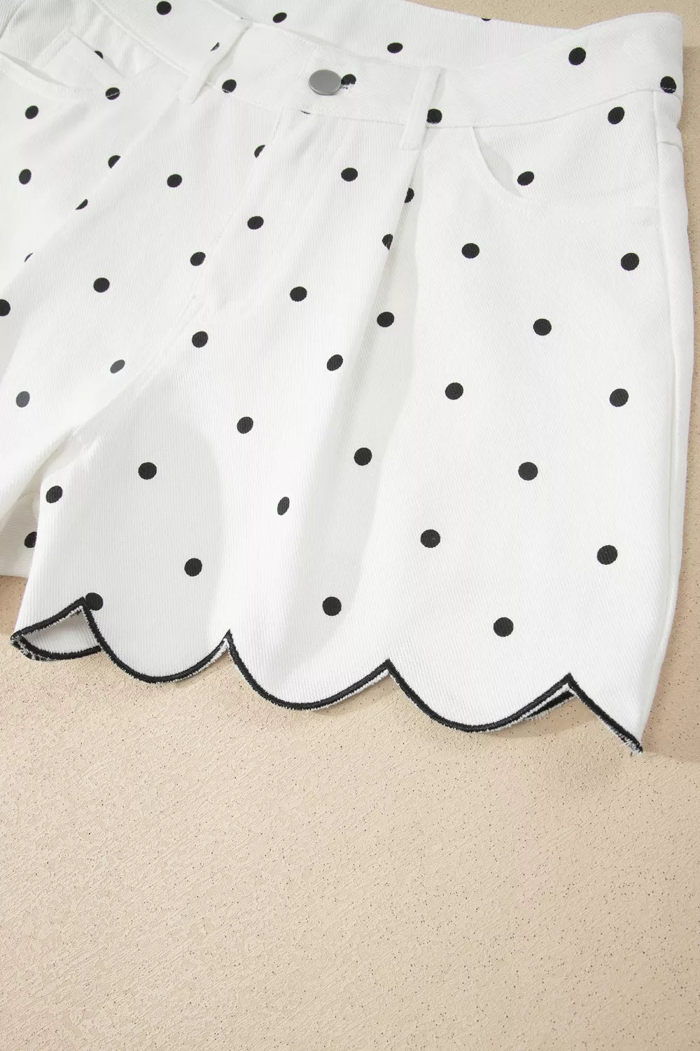 White polka dot shorts pocket area detail