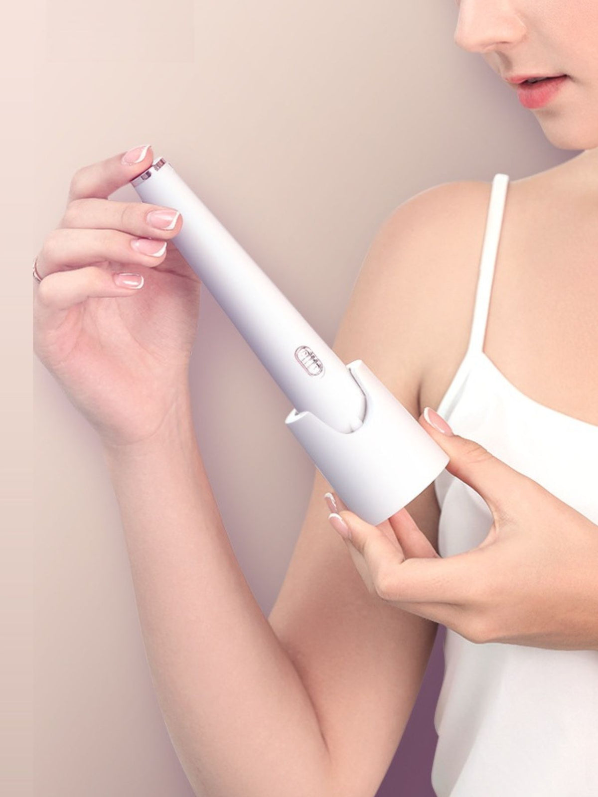 Electric manicure tool held in hand