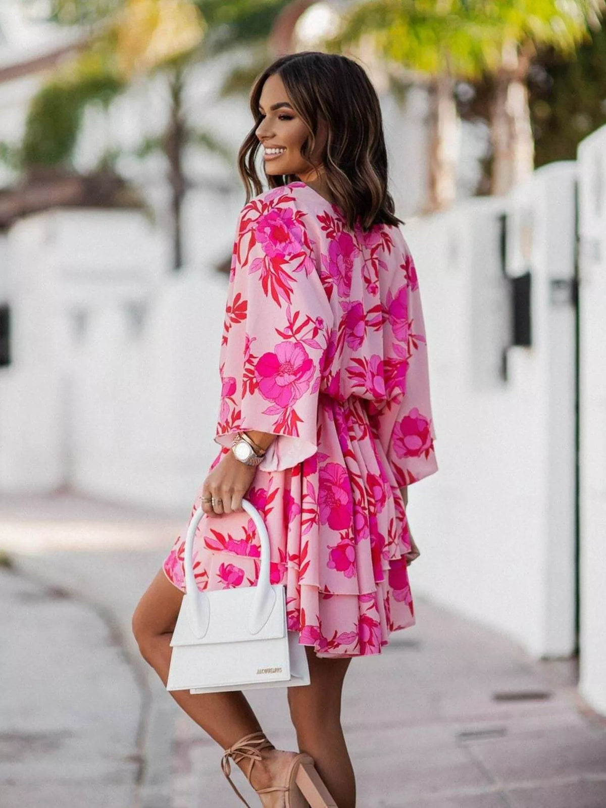 Printed surplice tiered mini dress styled view