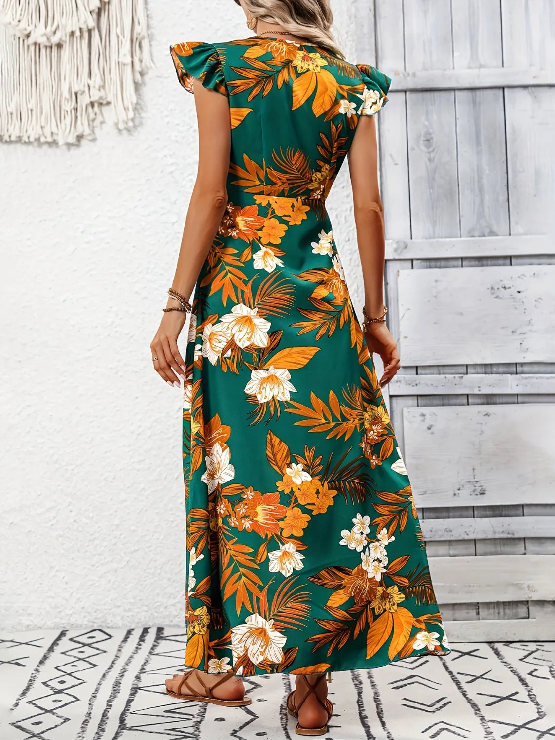 Dark green high low printed cap sleeve maxi dress, skirt and hem detail