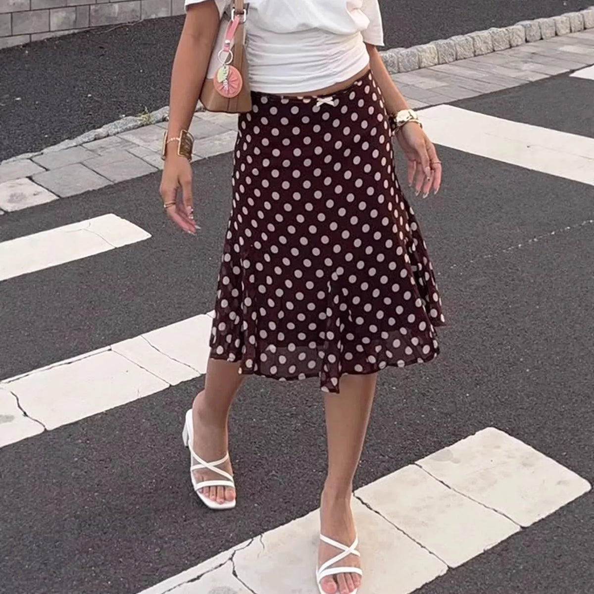 Dark brown polka dot midi skirt full length view