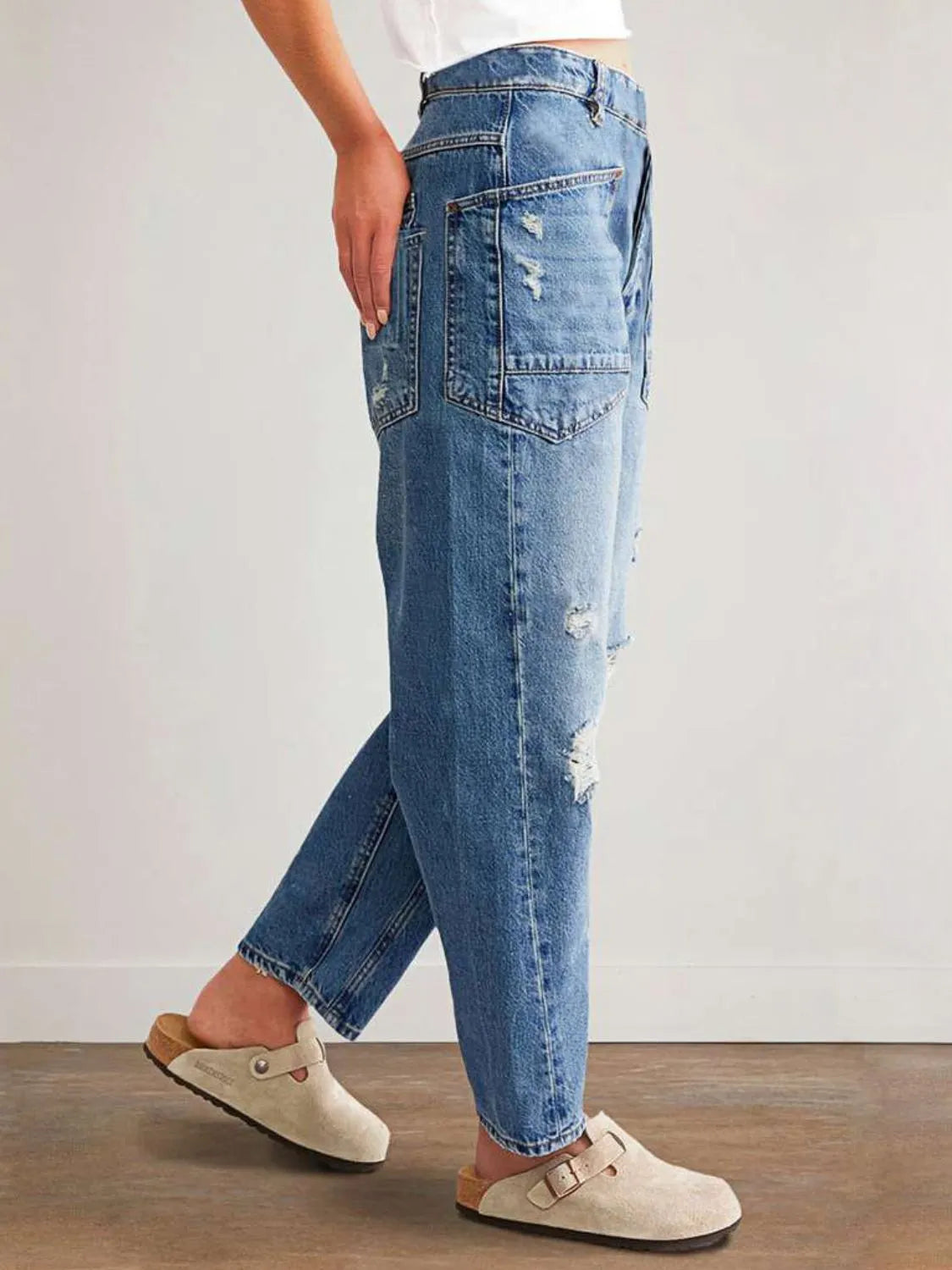 Ripped distressing on straight leg jeans