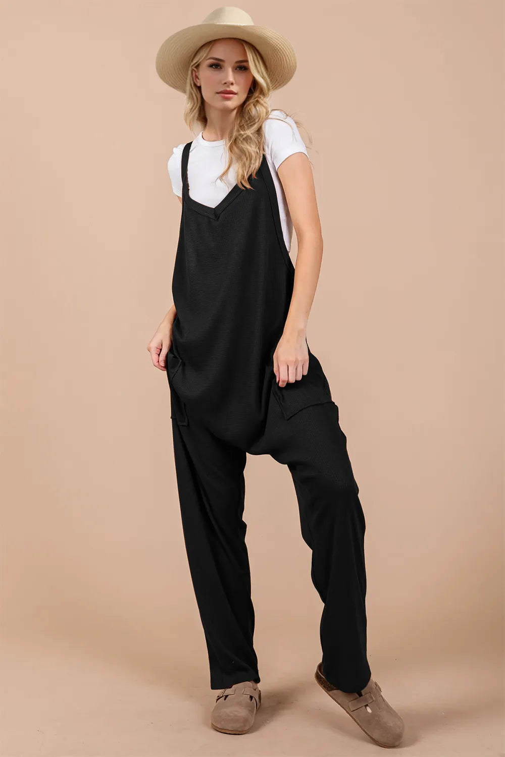 Black V neck wide strap overalls front view