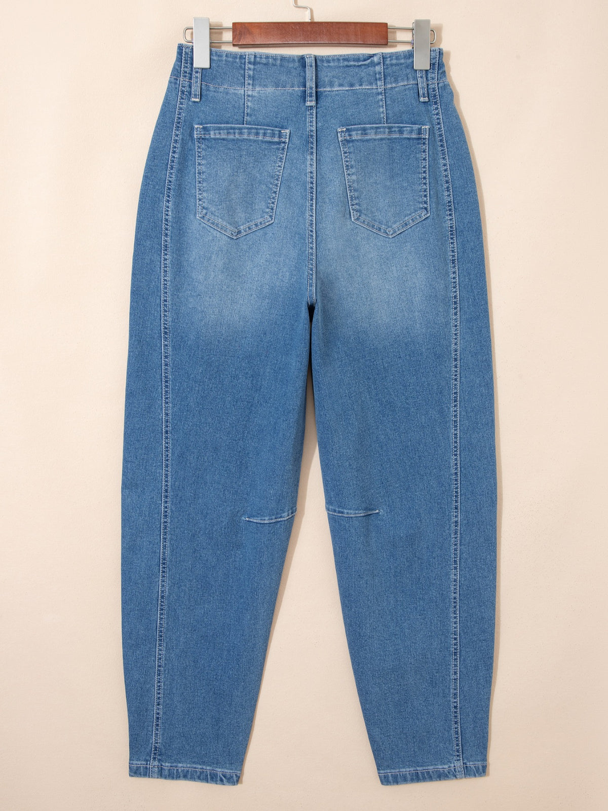 Cuffed hem detail on barrel leg jeans
