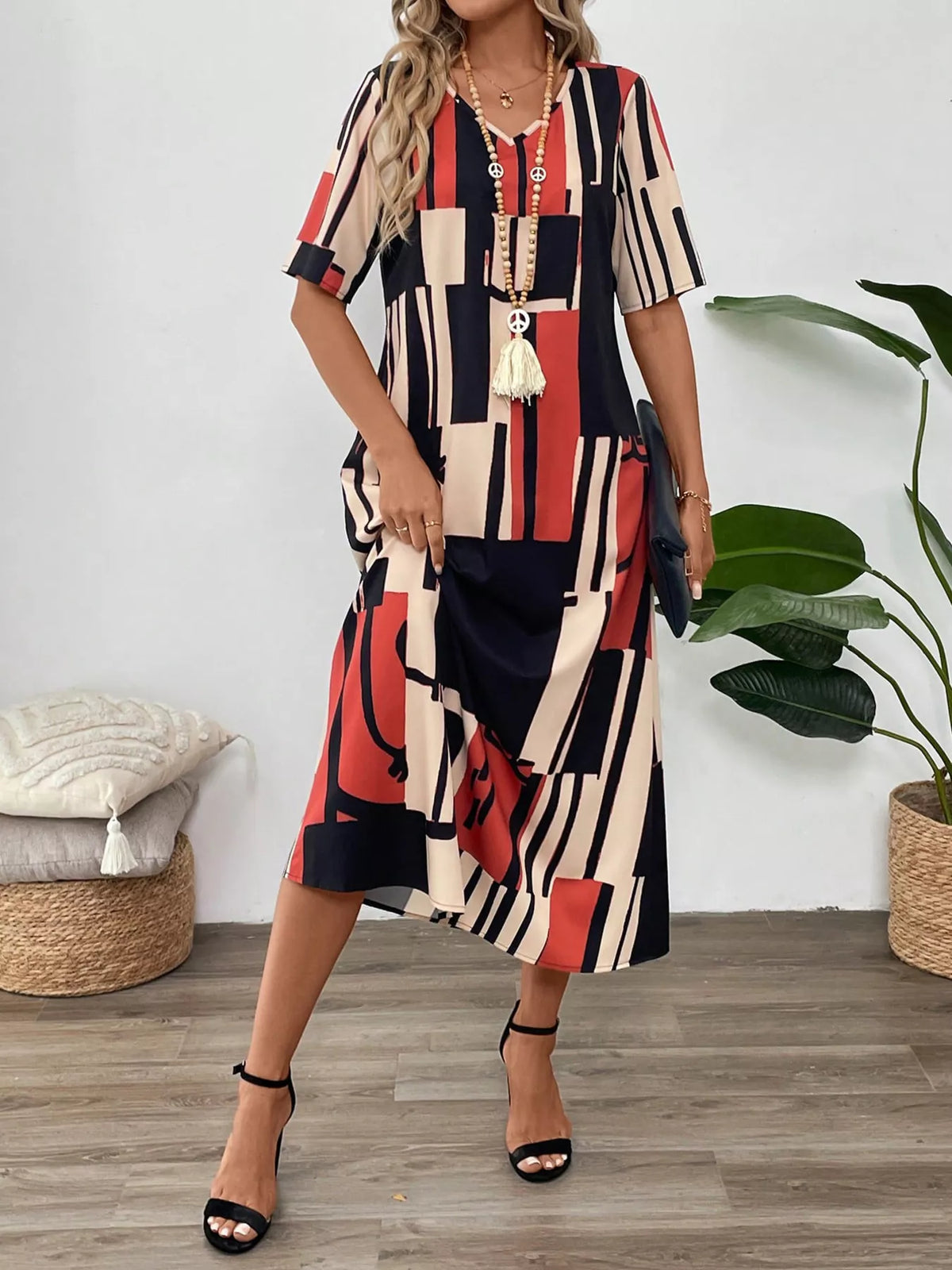Abstract geometric print v neck midi dress styled view