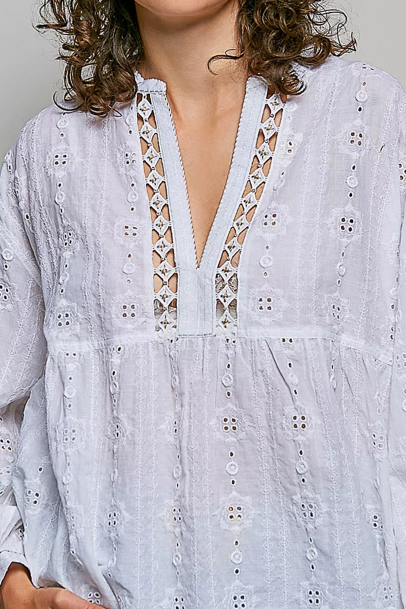 Vertical lace panel detail across the body of the blouse