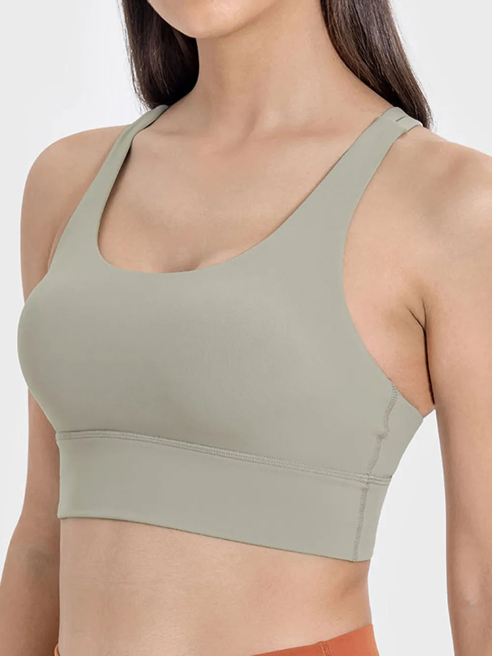 Crisscross scoop neck active tank hem detail