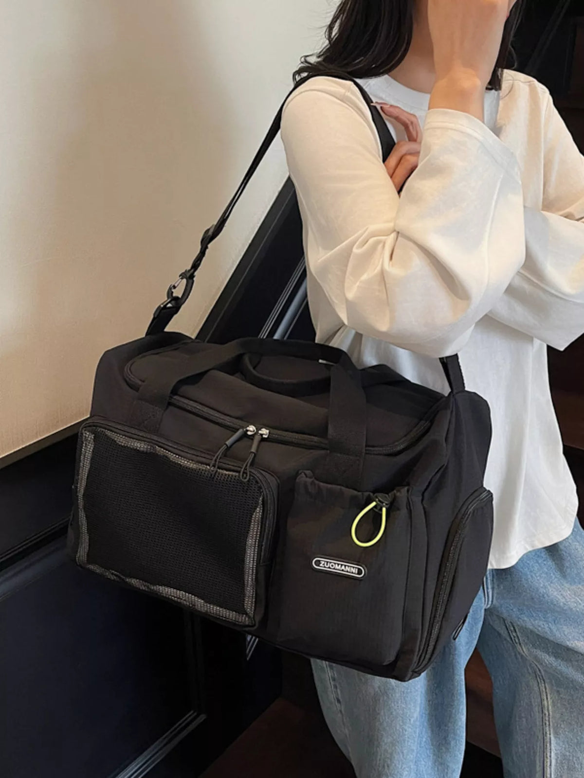 Black drawstring multi pocket travel duffel bag