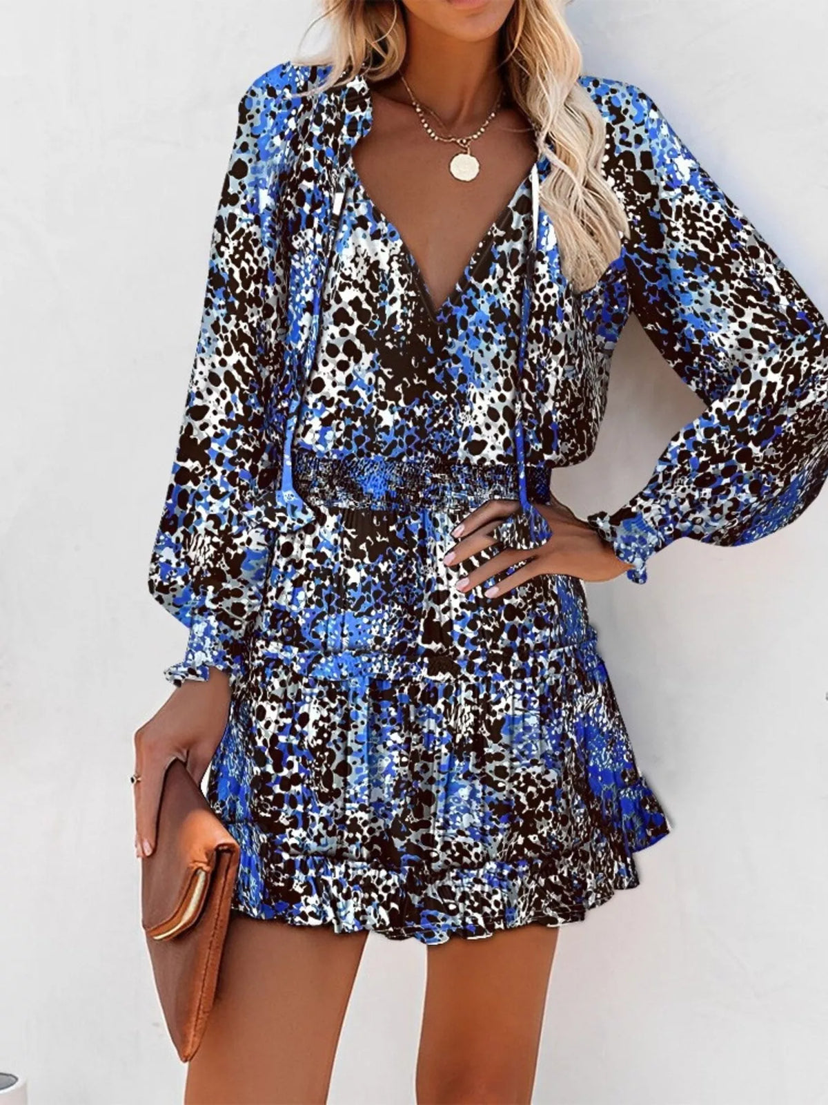 Tie neck lantern sleeve tiered dress back view