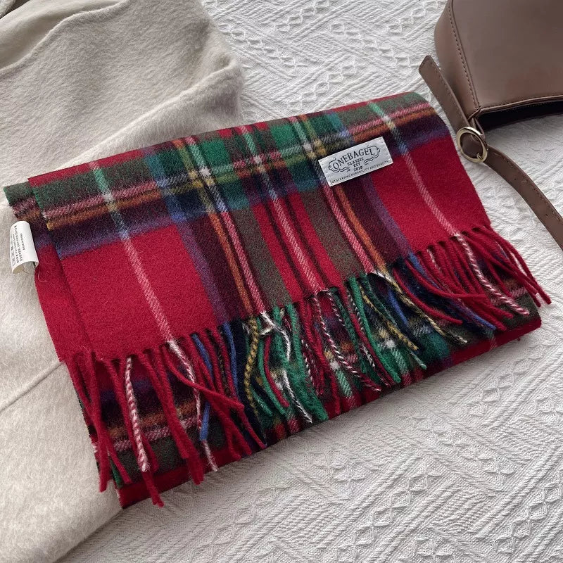 Wool plaid tassel scarf draped over a coat