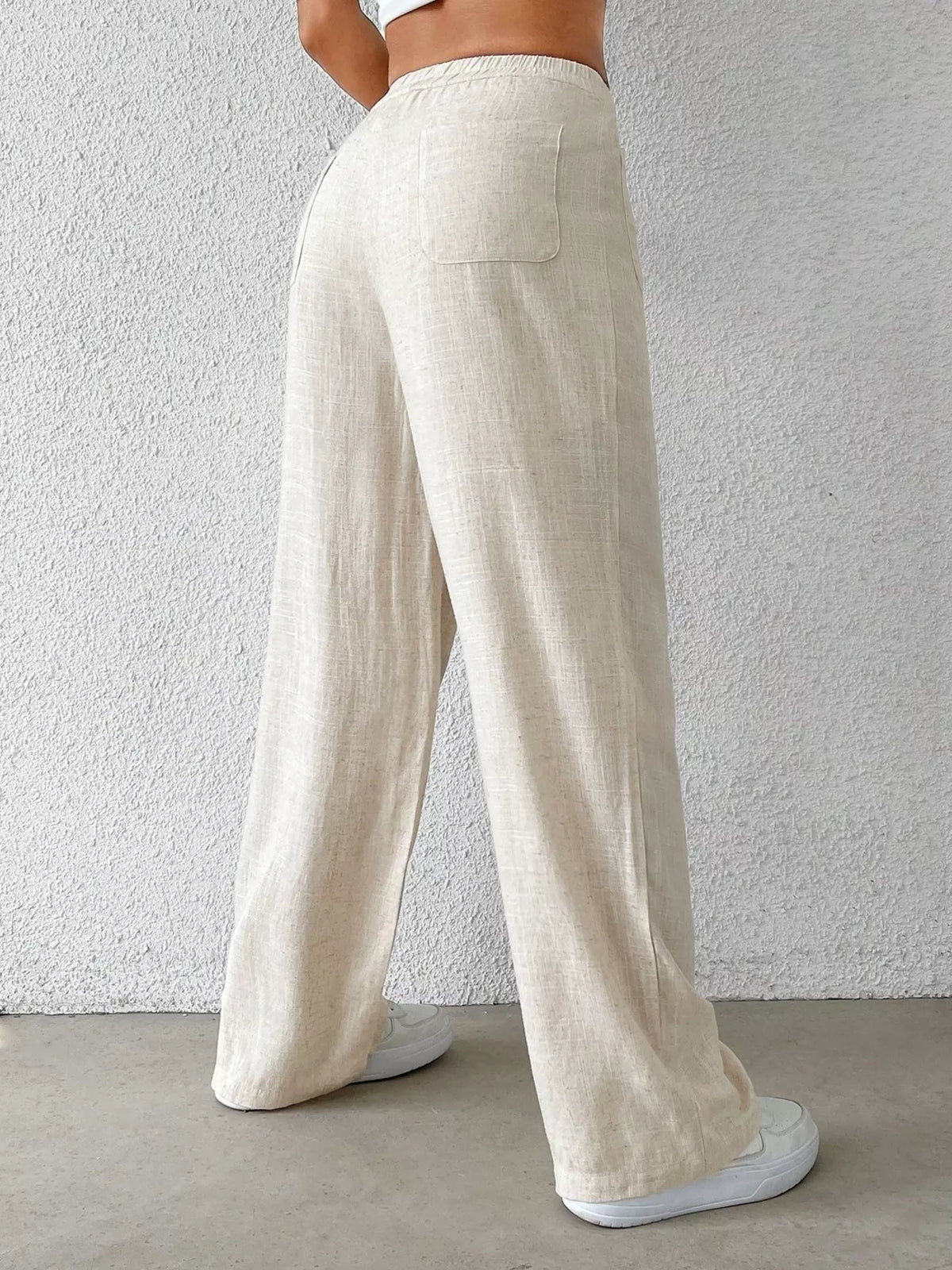 Cream high waisted wide leg linen blend pants front view