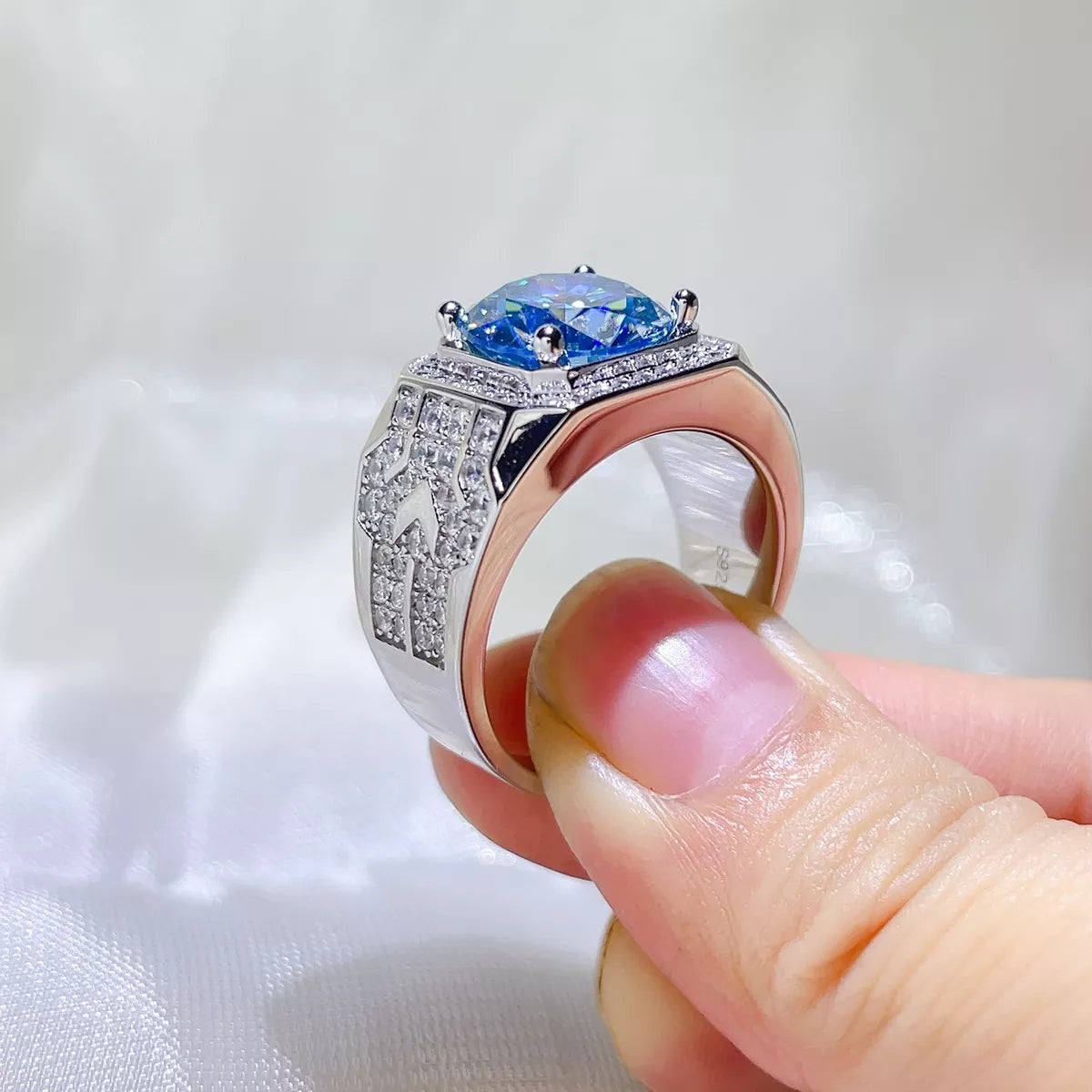 Close up of the pastel blue moissanite stone and setting
