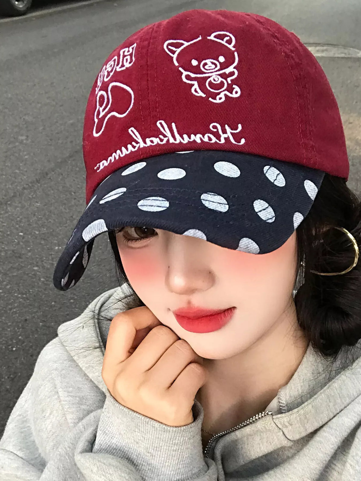 Side profile of the polka dot embroidered baseball cap