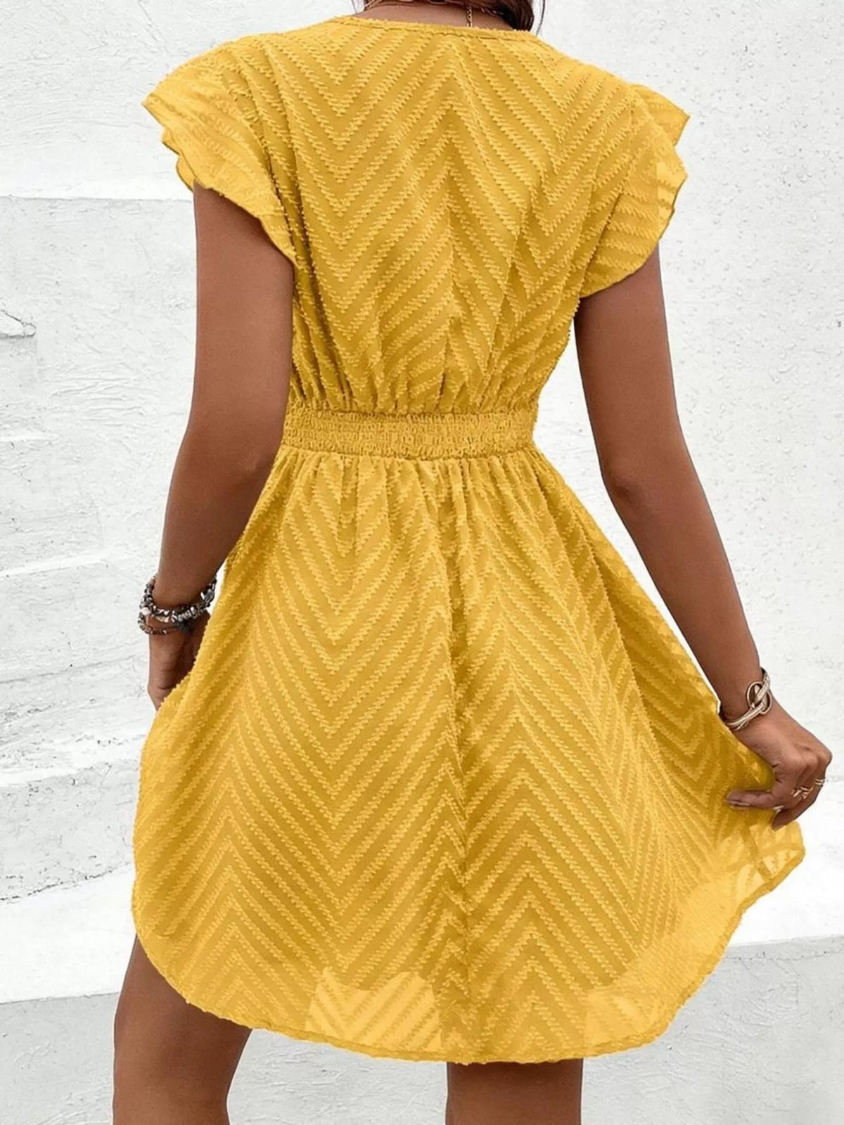 V neck ruffle sleeve mini dress, styled on model