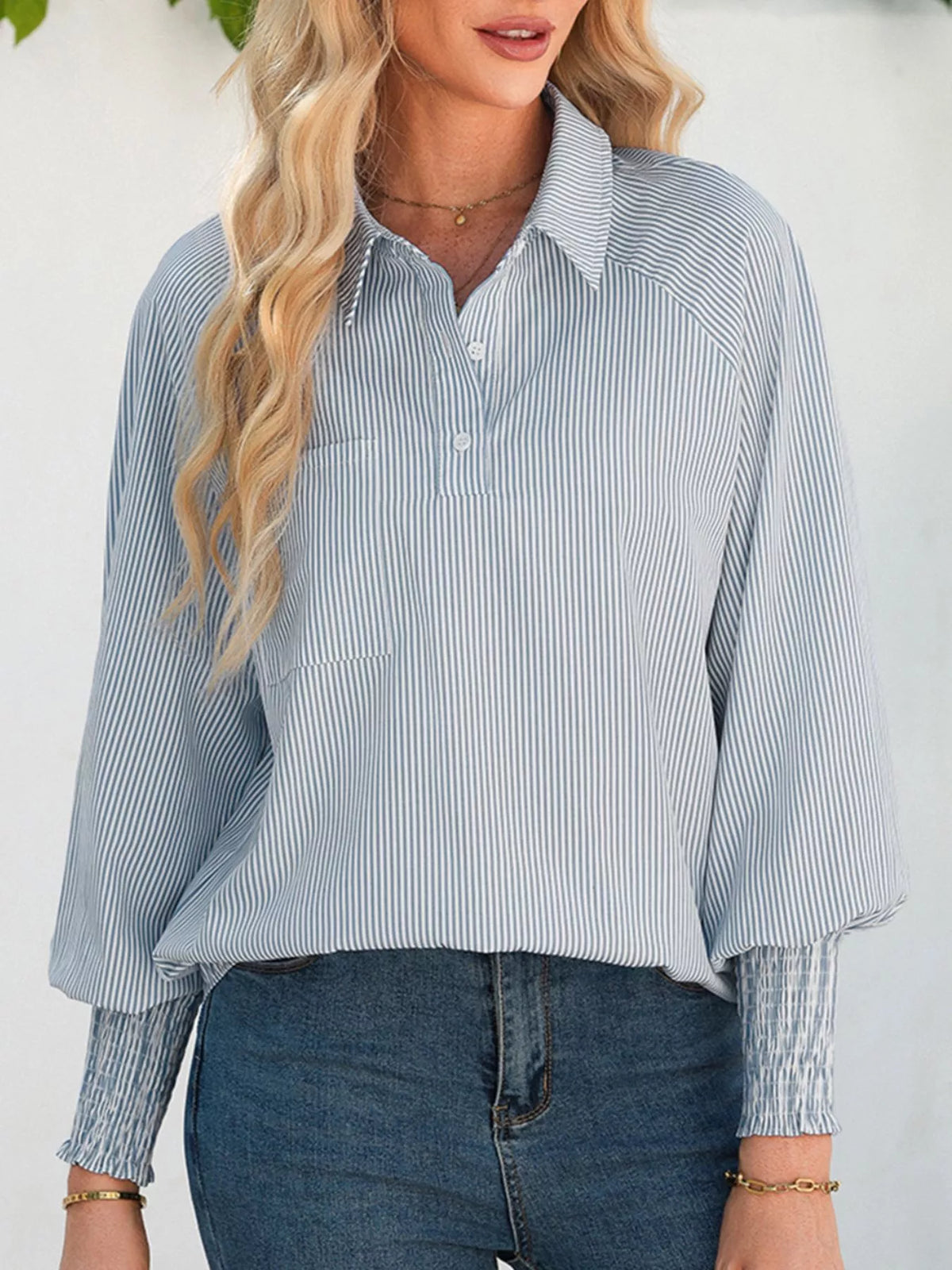 Sleeve detail with the cuff pushed up the arm