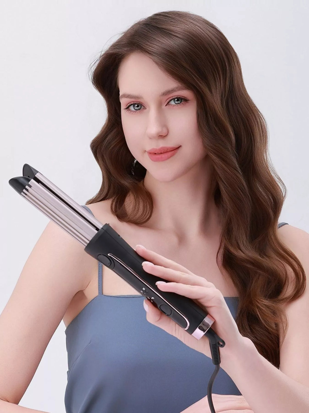 Curling iron in silver side profile