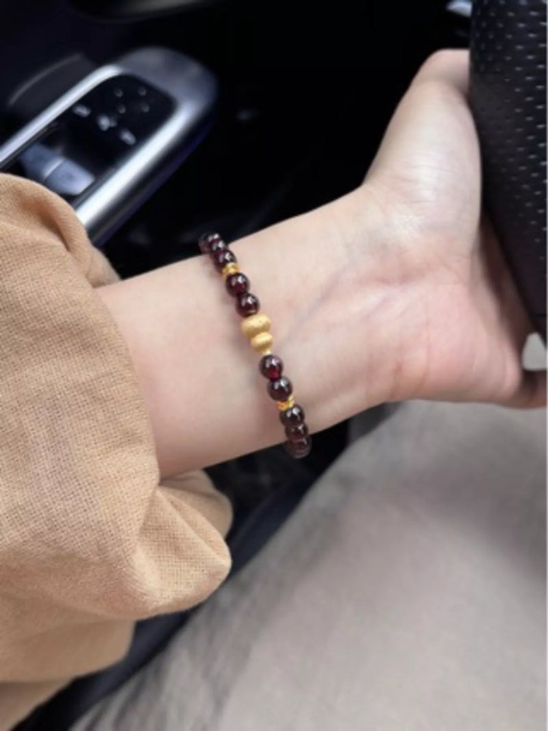 Gold gourd and garnet beaded bracelet front view