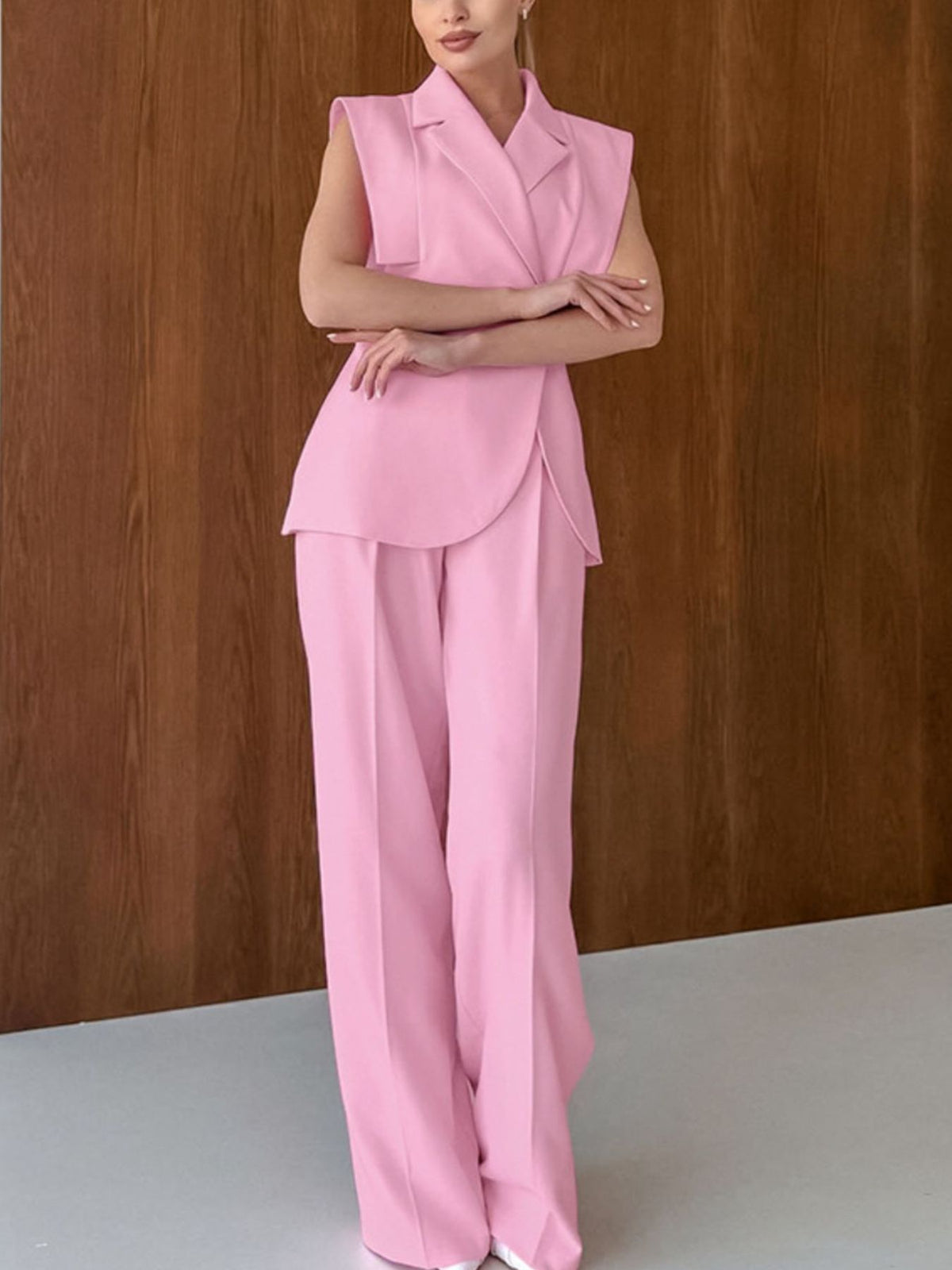 Coordinated sleeveless blazer and wide leg pants outfit