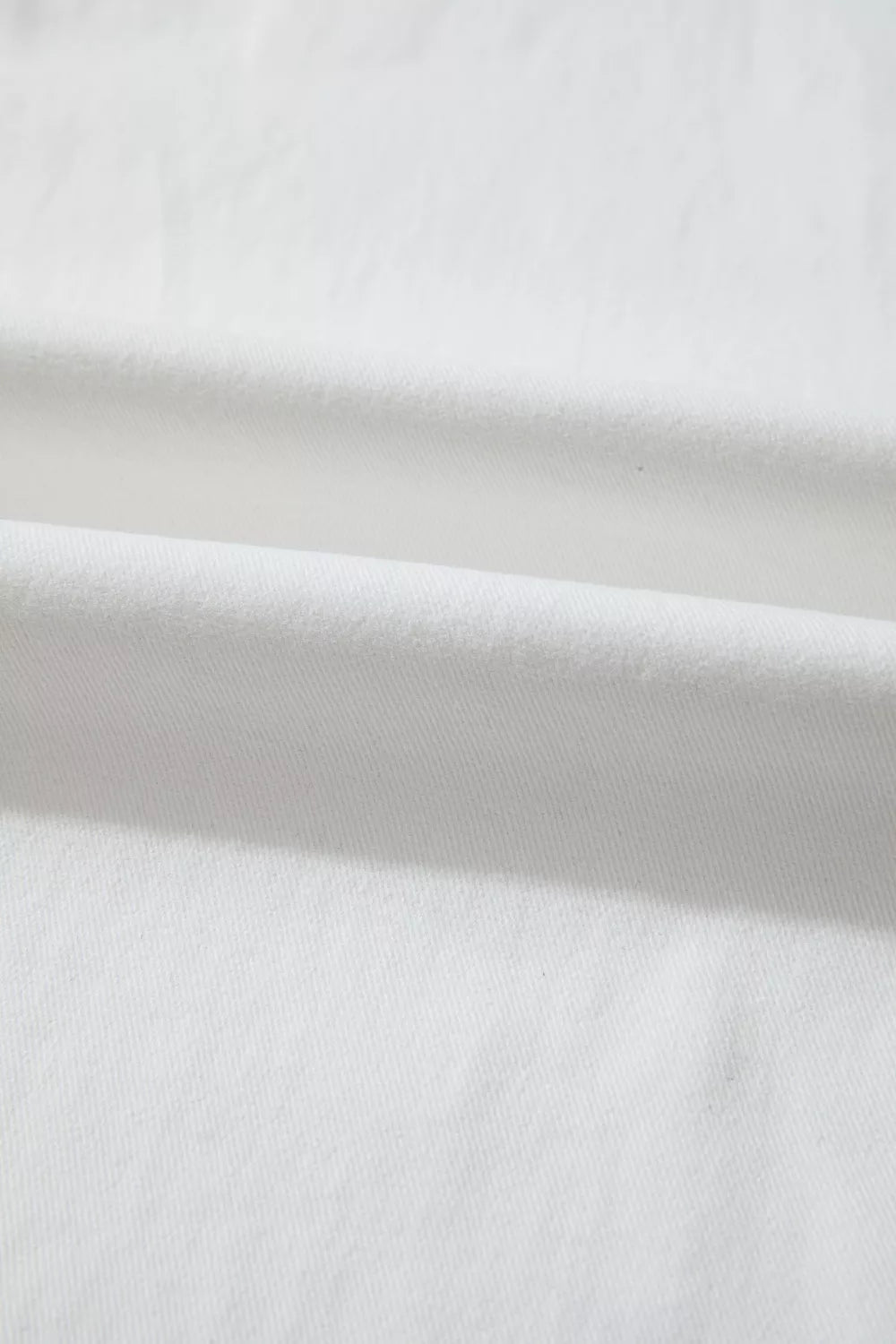 White loose fit denim close up