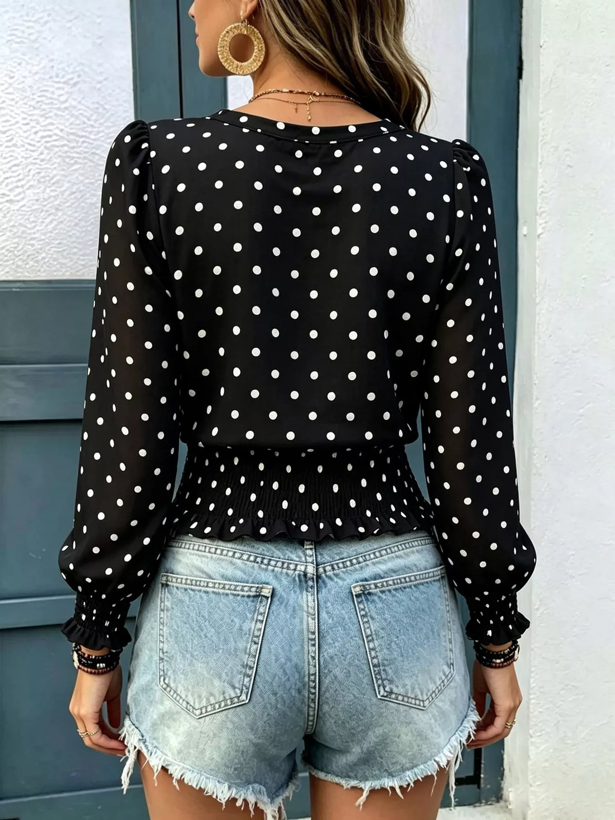 Smocked blouse shown in black
