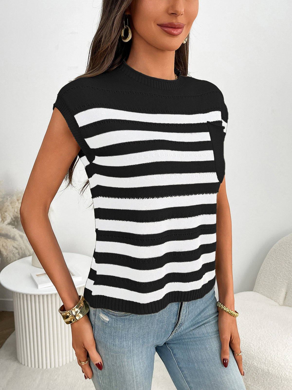 Pink striped cap sleeve sweater styled on model