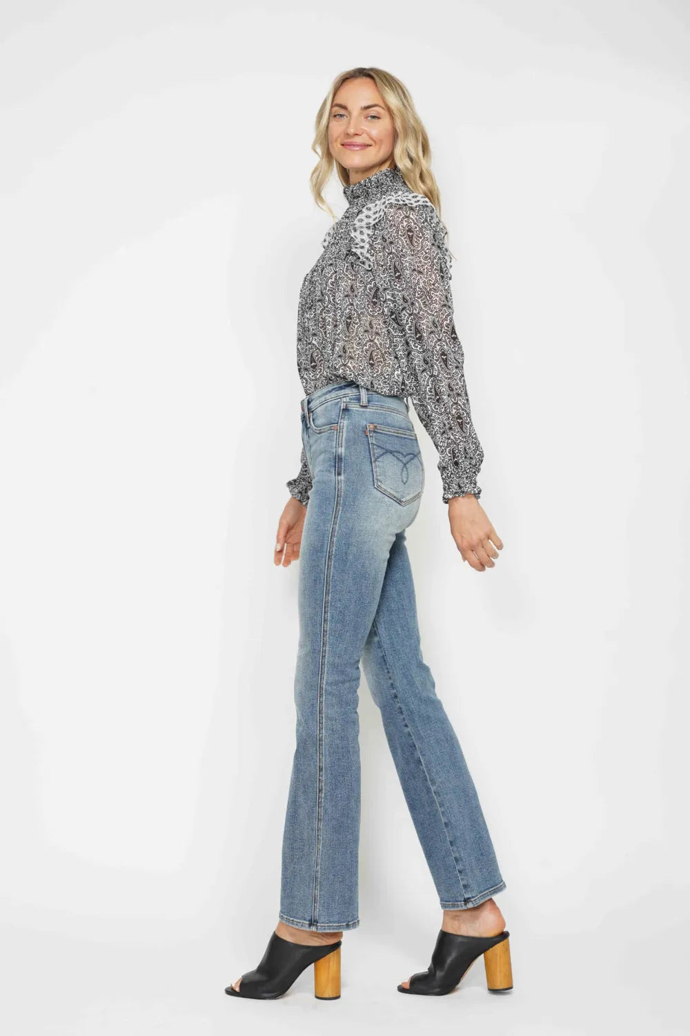 Bootcut leg opening and hem detail on the denim