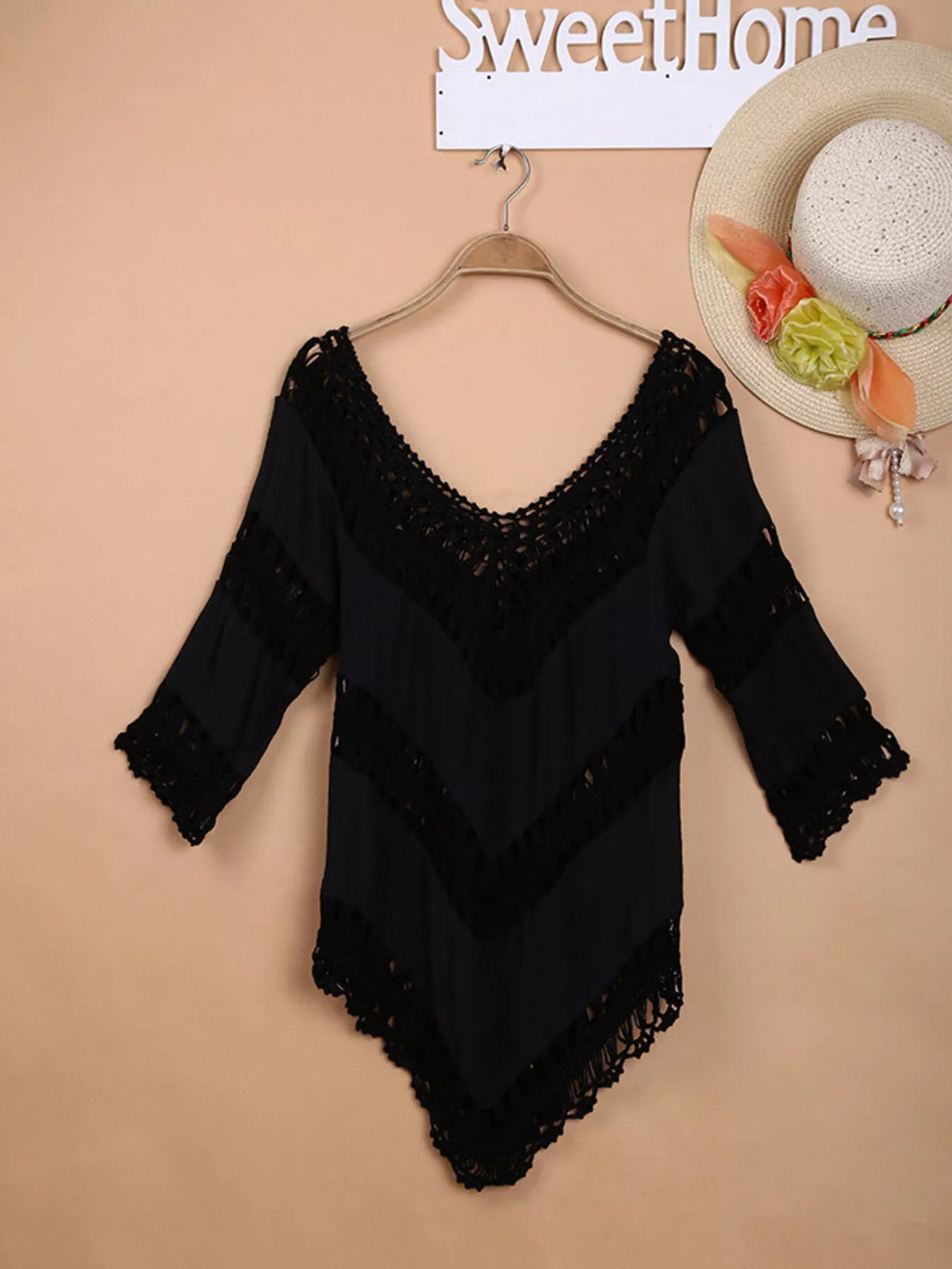 Crochet cover up in black over a bikini