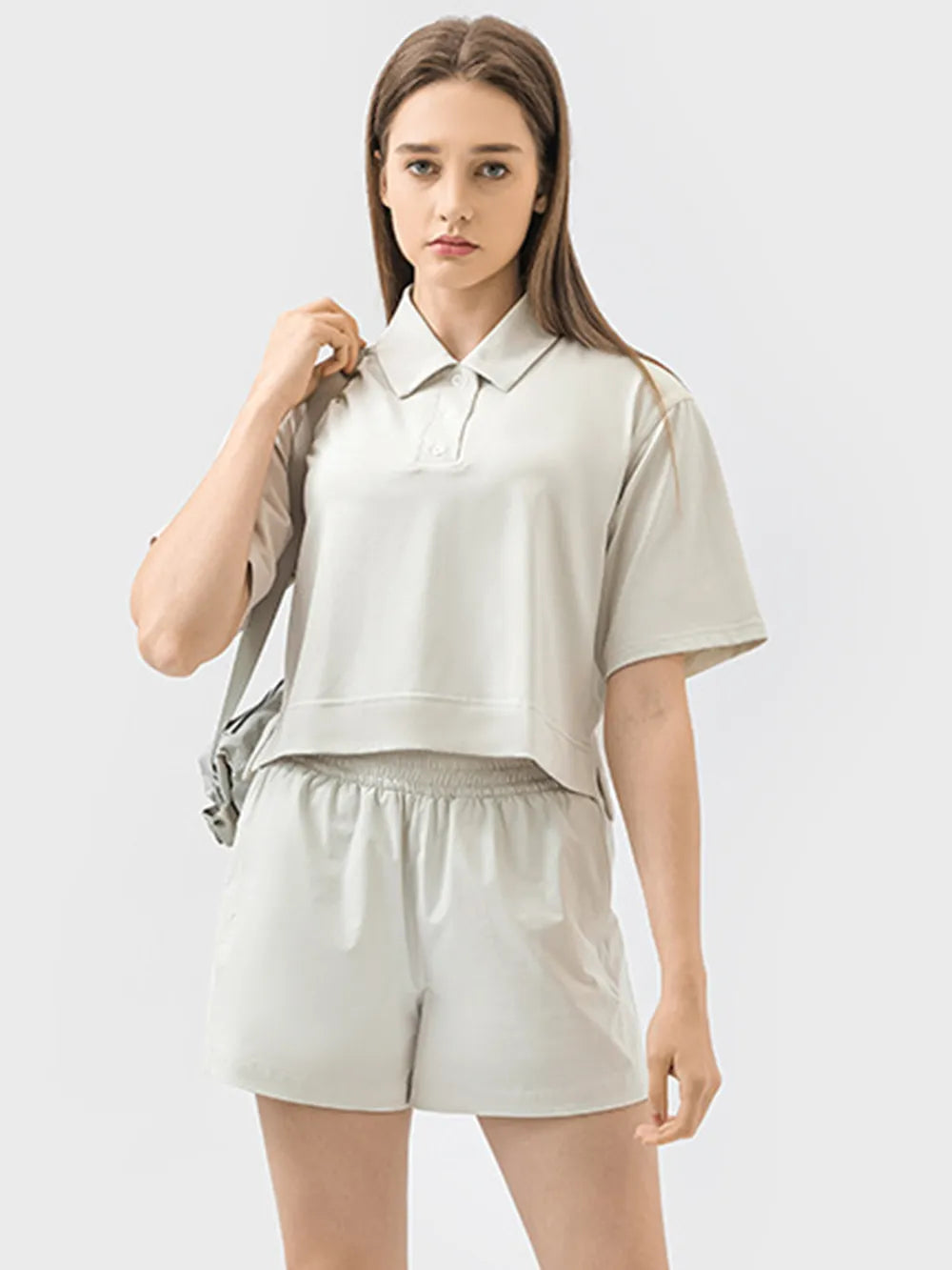 Half button short sleeve active tee styled view