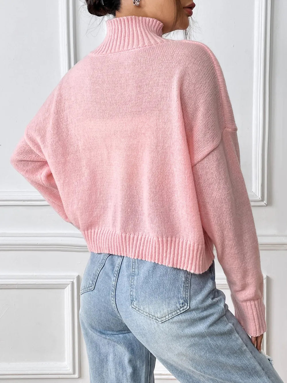 Feminine bow turtleneck sweater sleeve detail