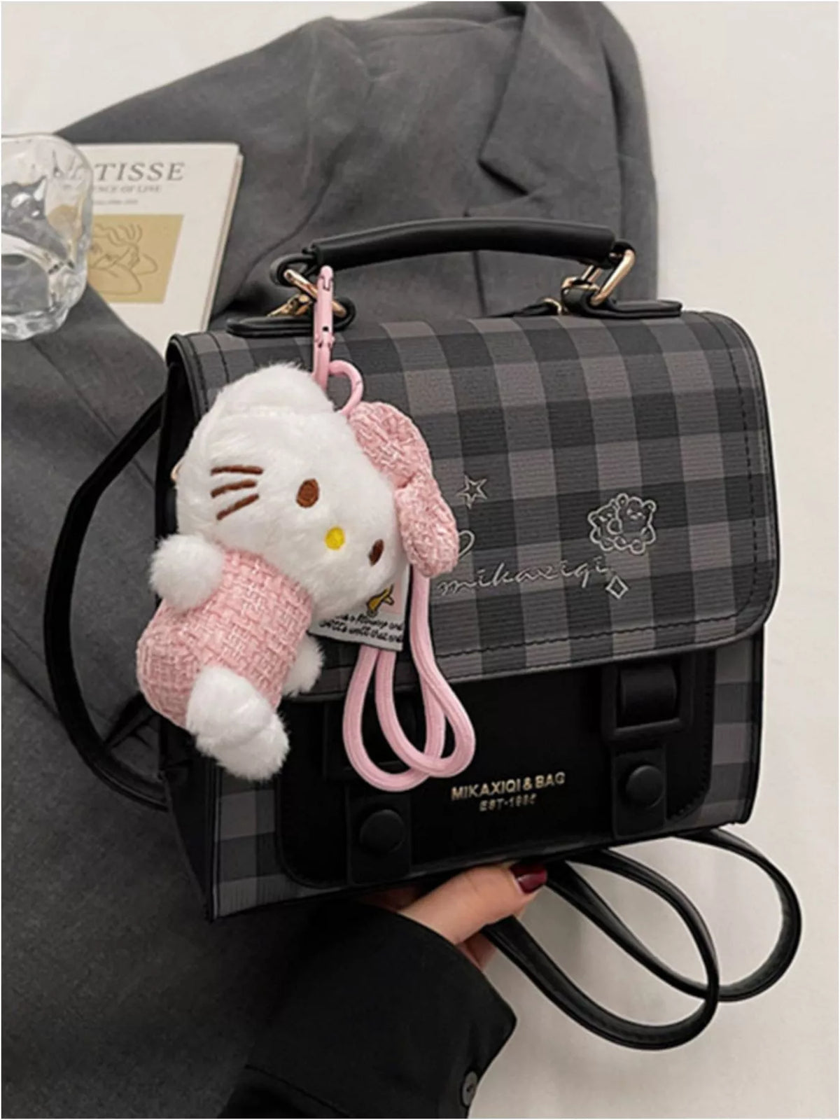 Black plaid embroidered flap mini backpack side profile