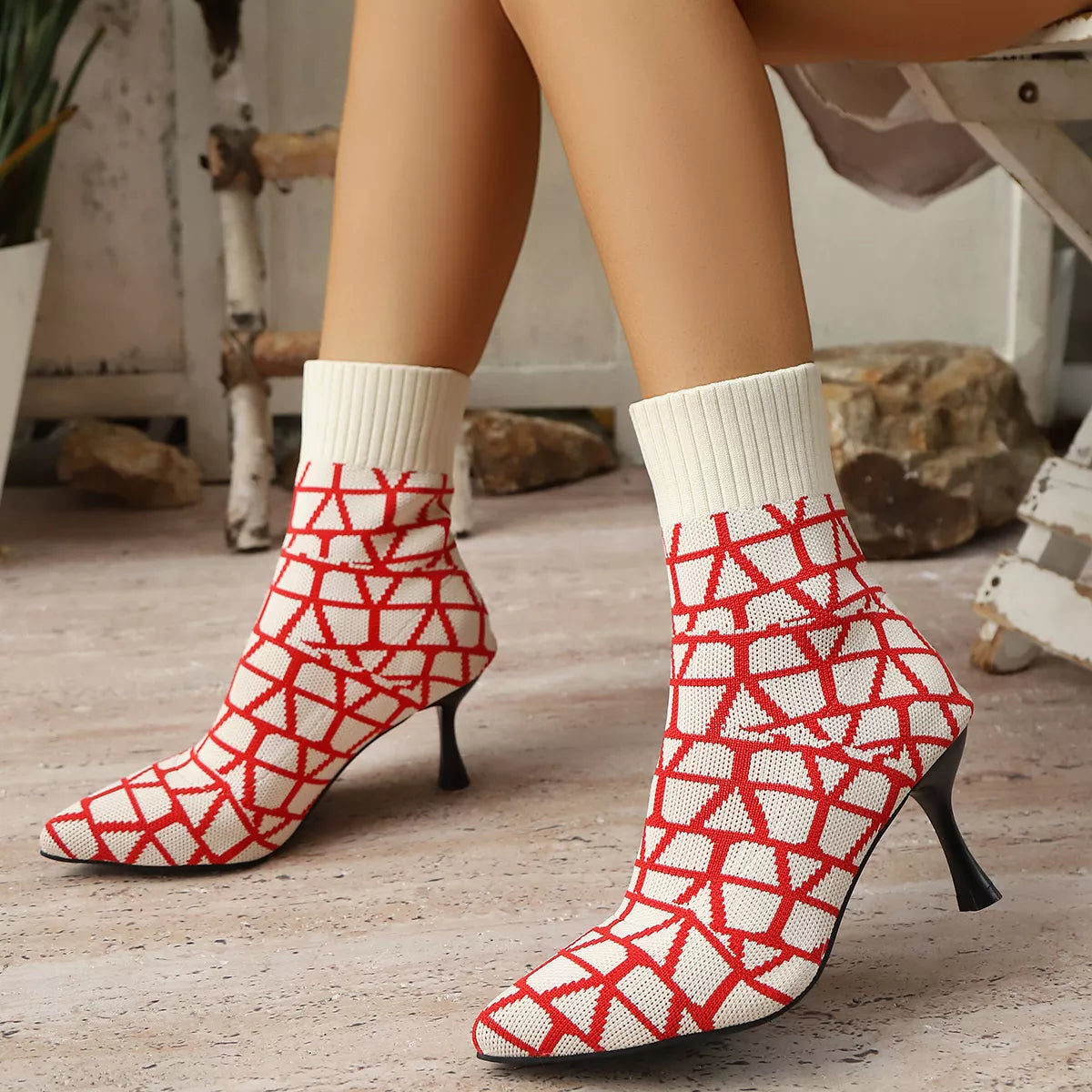 Black point toe flared heel boots side profile view