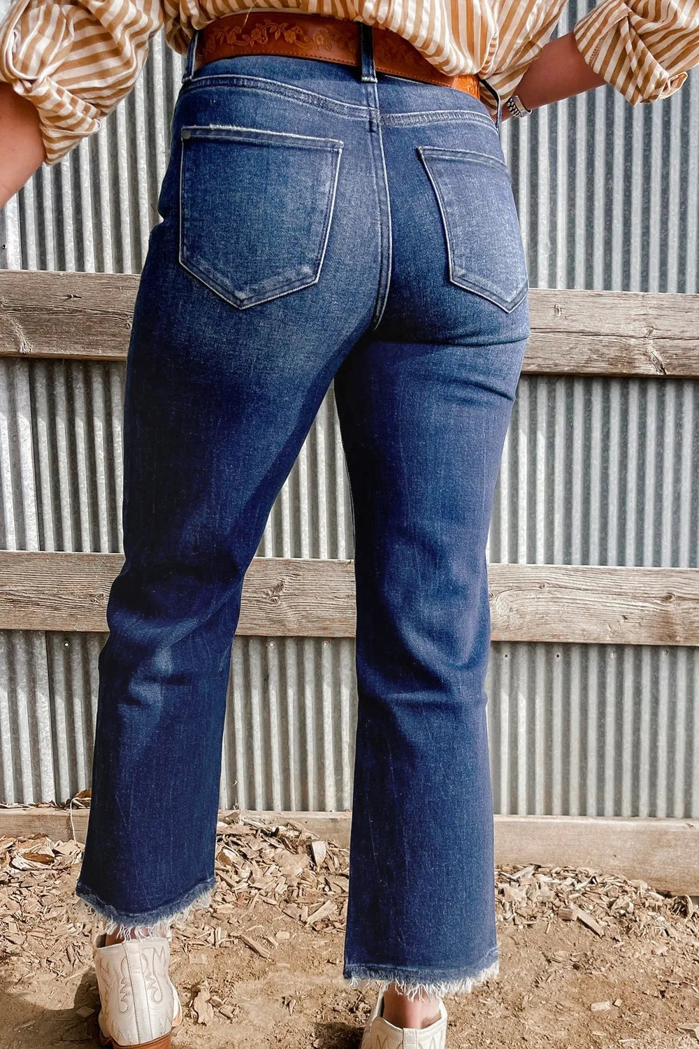 Back view of raw hem flare jeans
