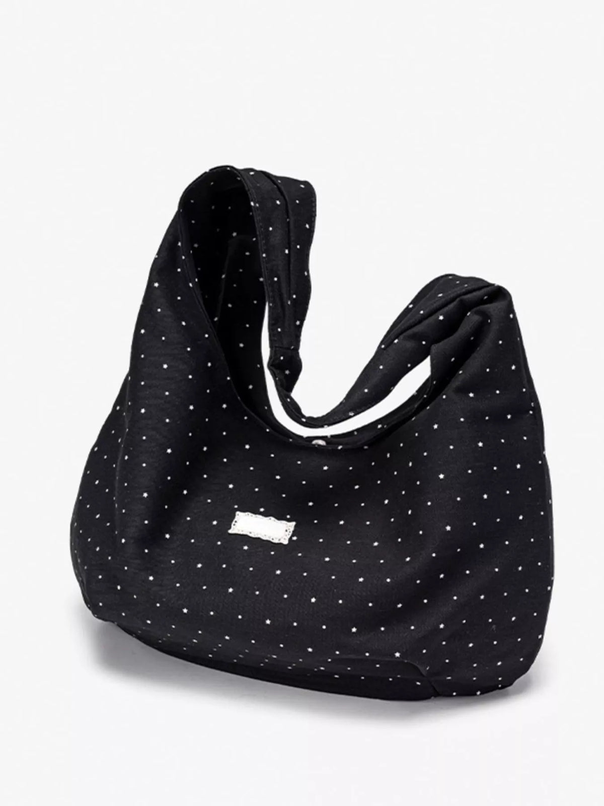 Polka dot bag carried on the shoulder