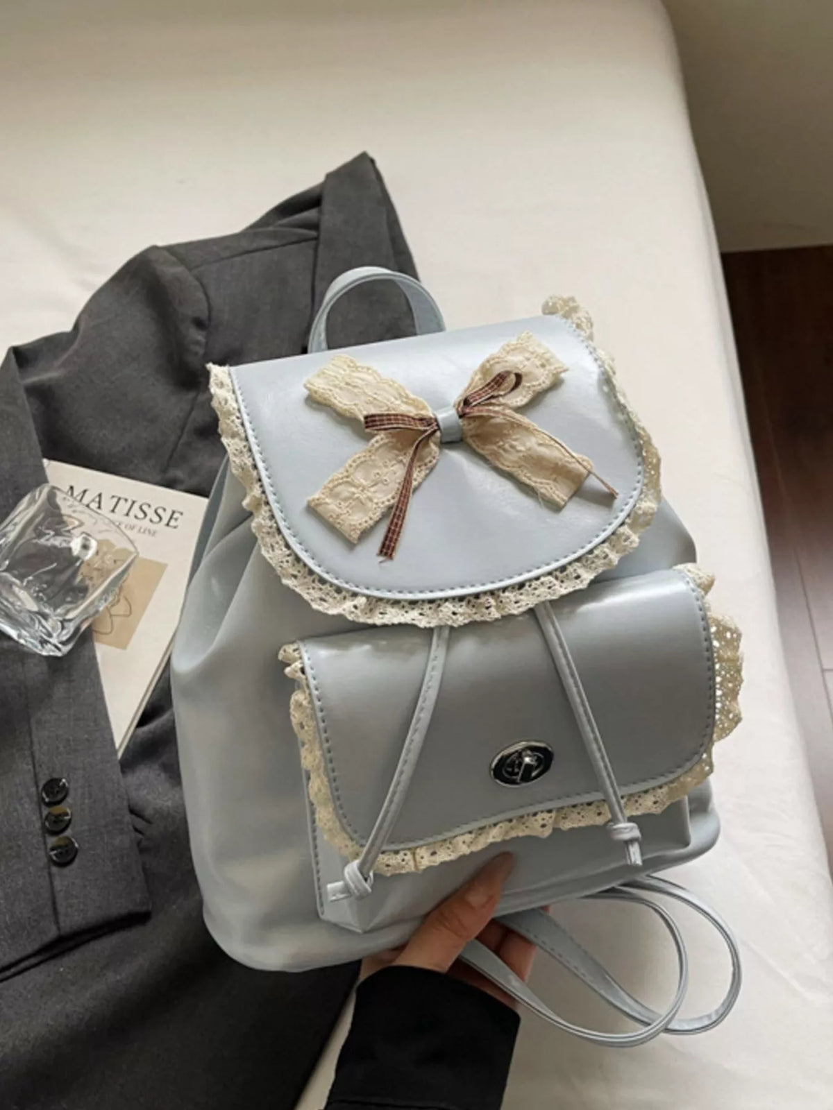Blue lace bow mini backpack back view