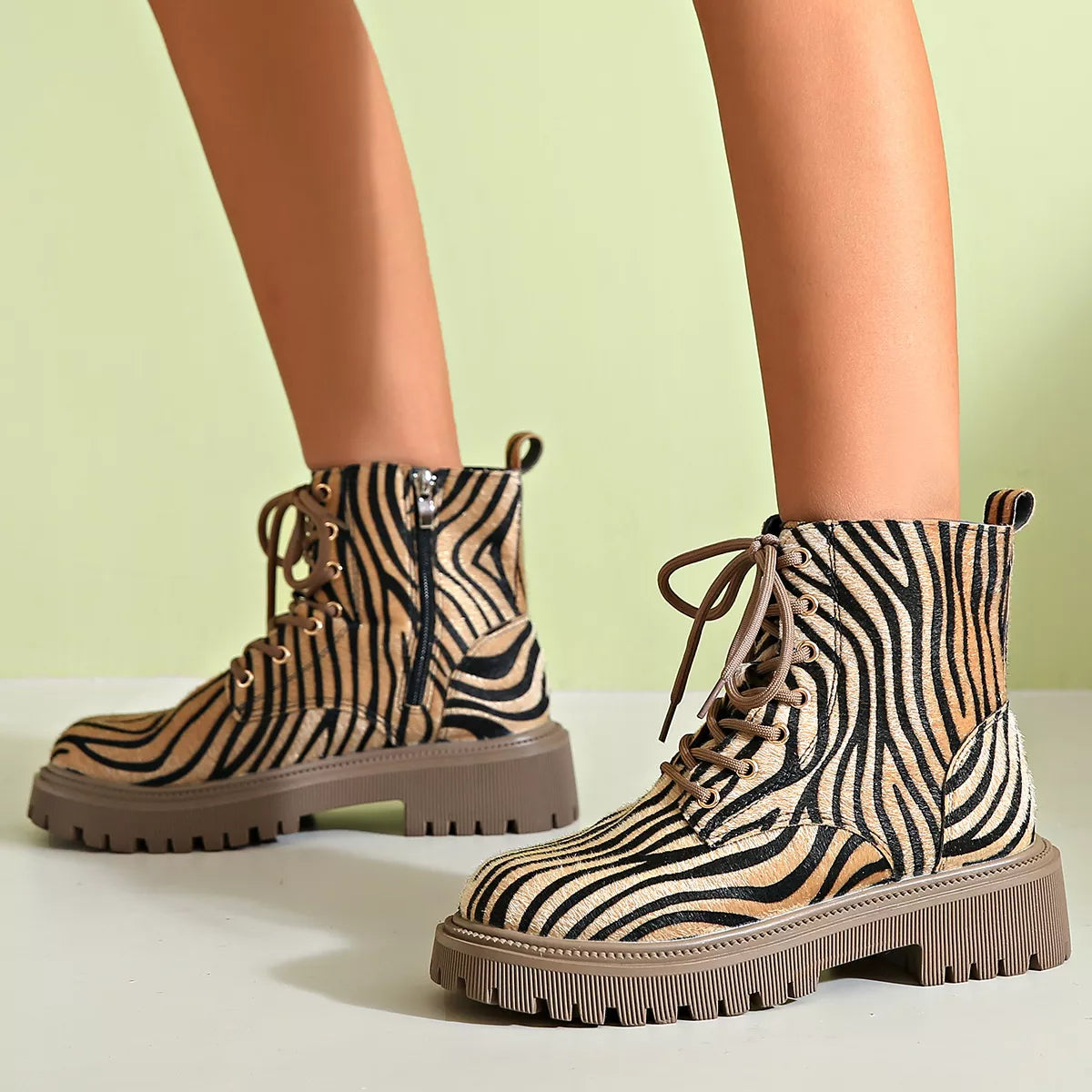 Animal print lace up ankle boots angled pair