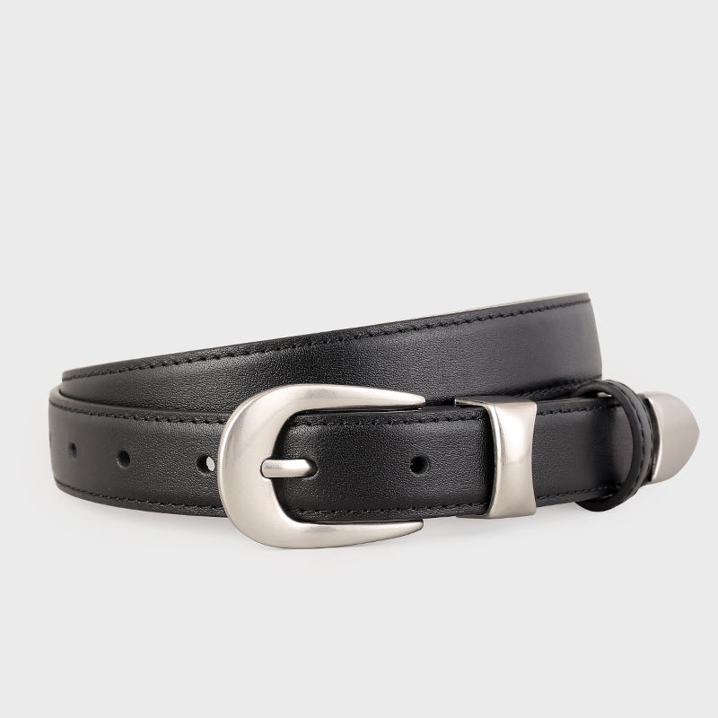Classic leather belt with silver buckle coiled