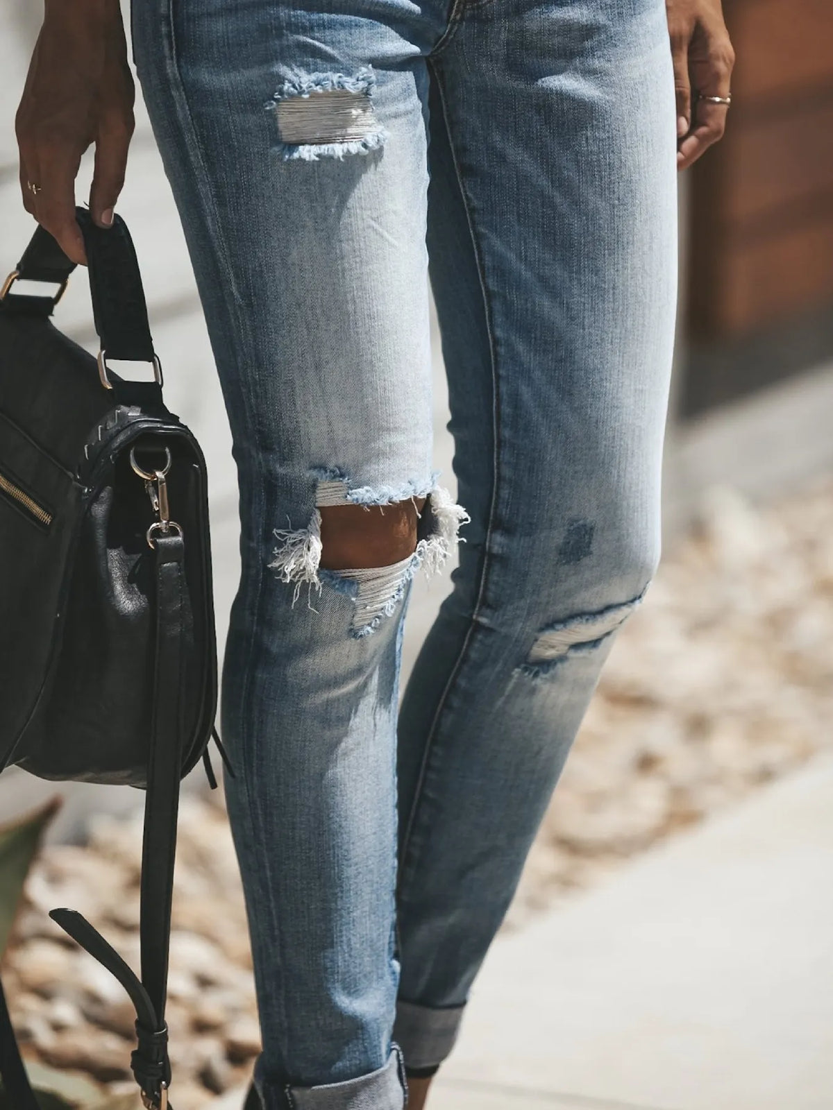 Distressed skinny denim jeans side view