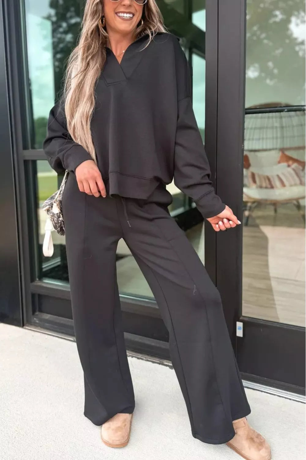 Black matching collared sweatshirt and sweatpants set detail